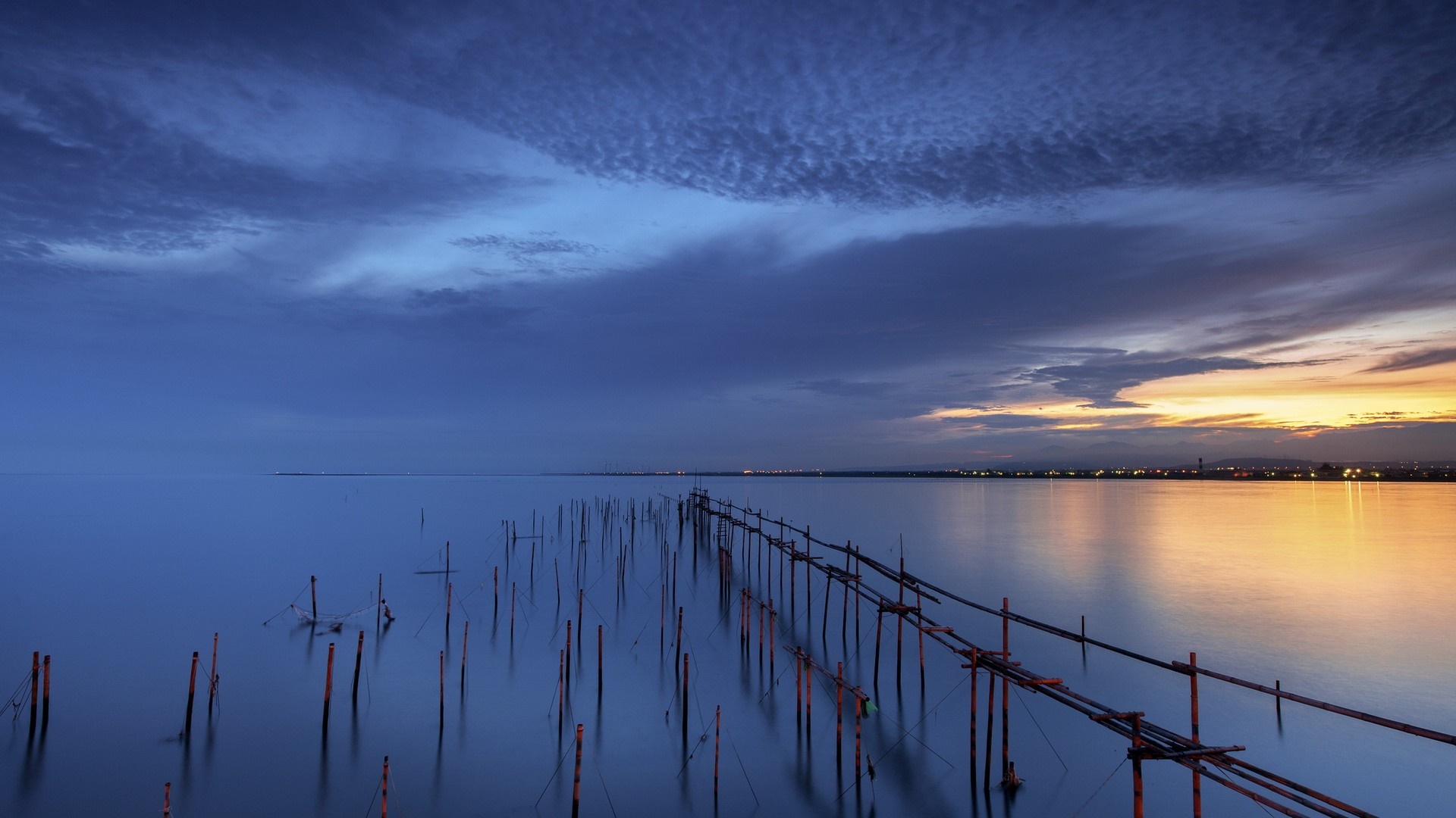 Wooden pier on a calm sea at sunset HD Wallpaper