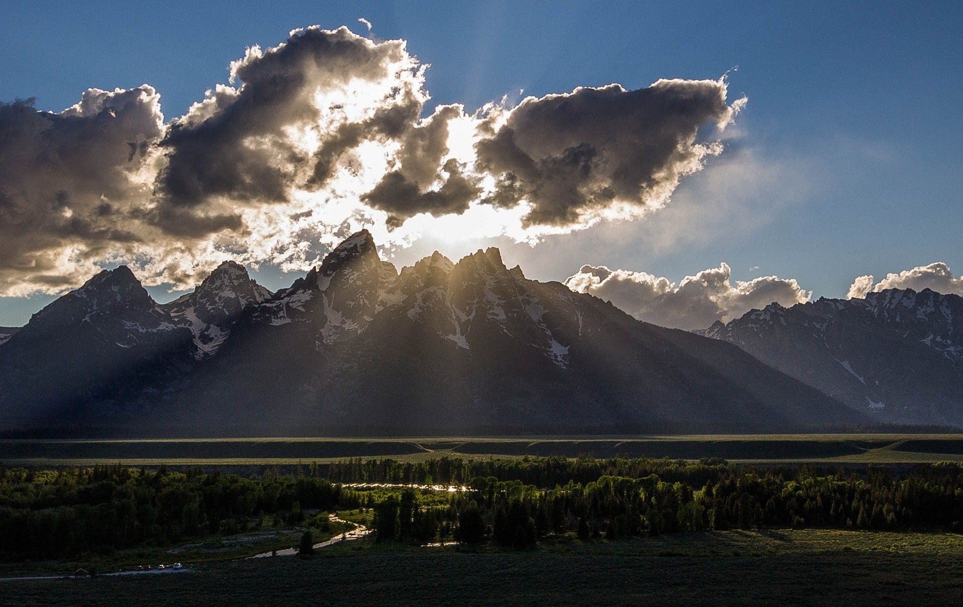 Sunbeams through clouds over mountains and river valley HD Wallpaper