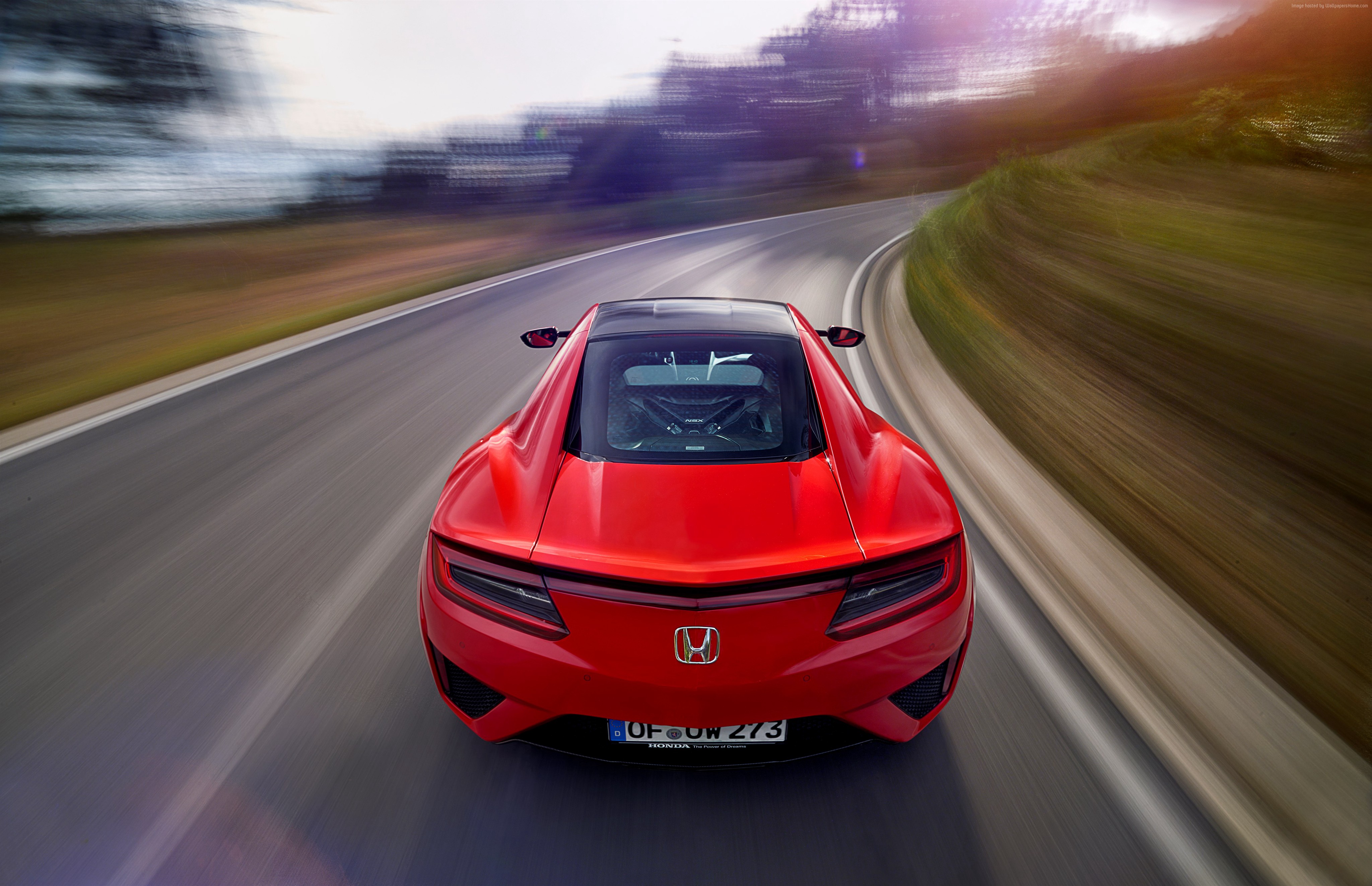 Red Honda NSX driving on a winding road HD Wallpaper