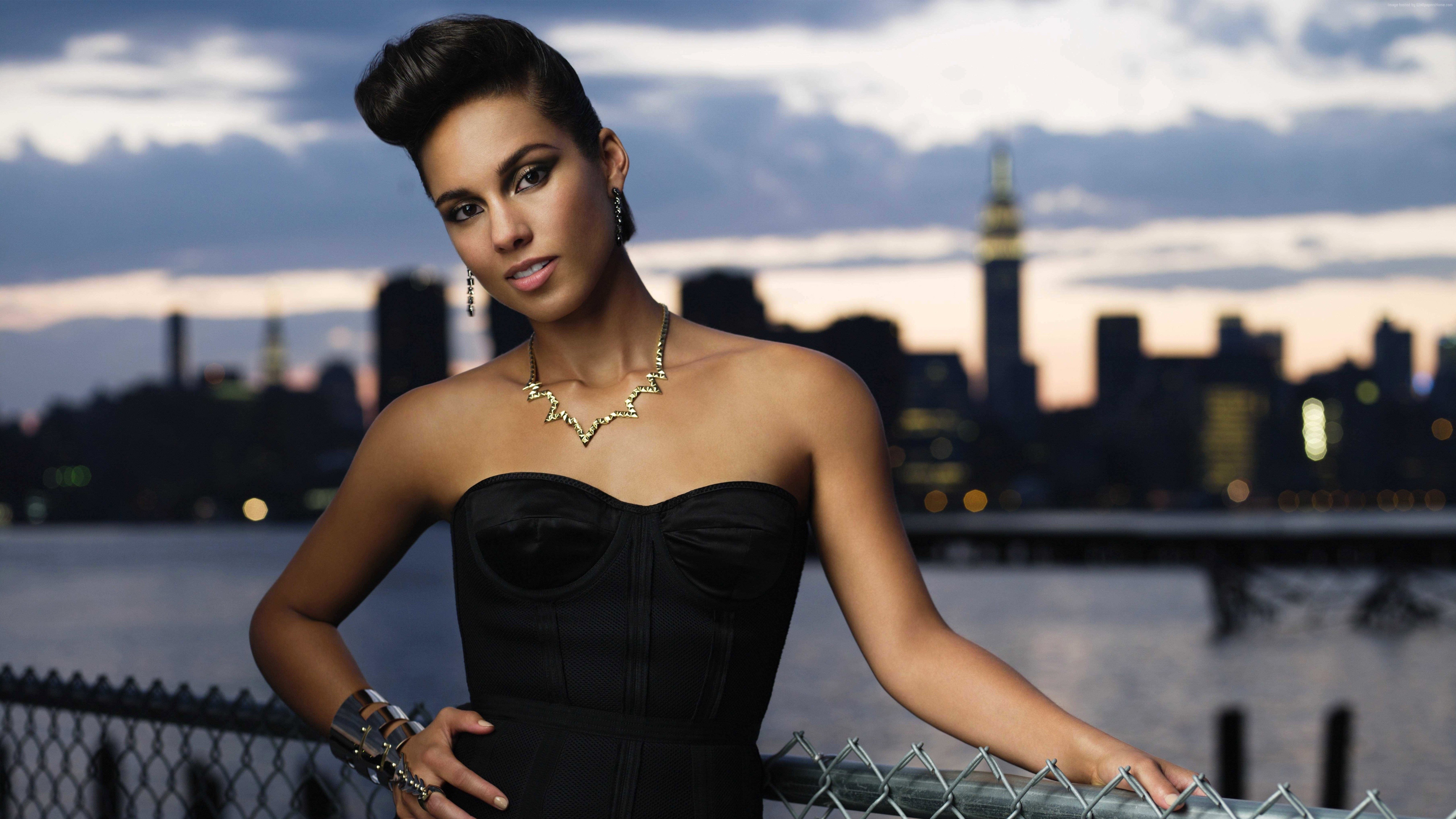 Alicia Keys posing in front of a city skyline HD Wallpaper