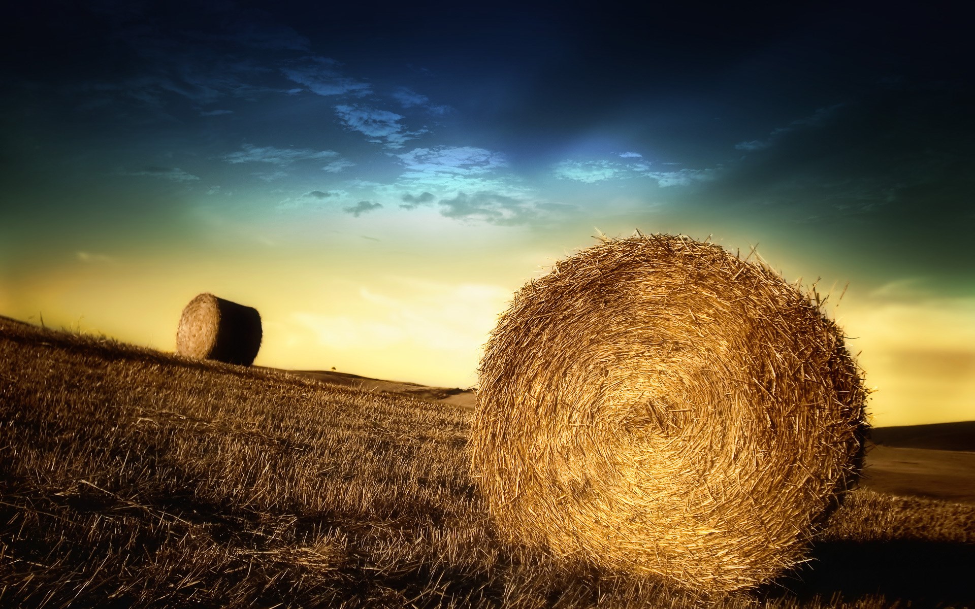 Hay bales in a field at sunset HD Wallpaper