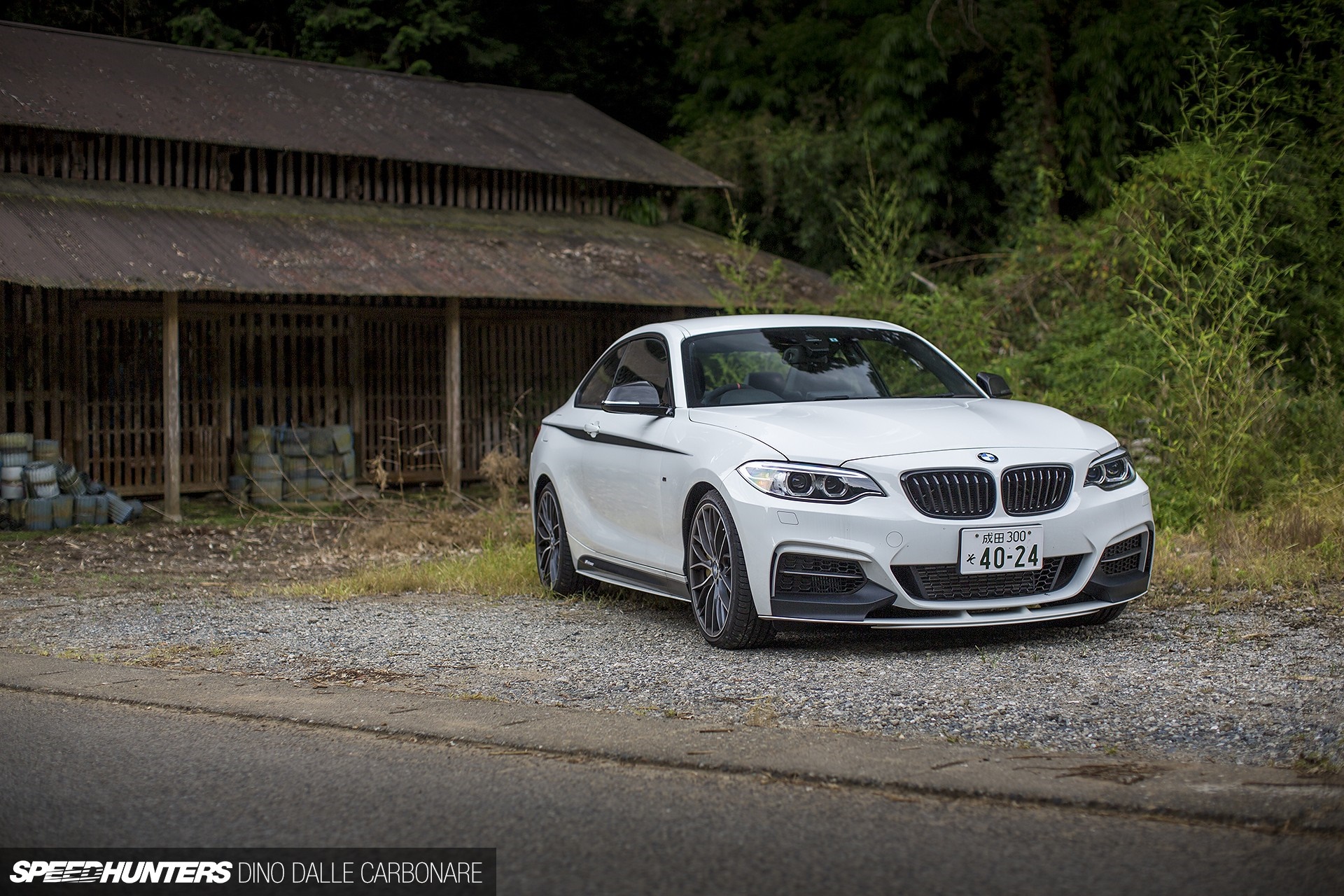 White BMW M235i Coupe parked near old building HD Wallpaper