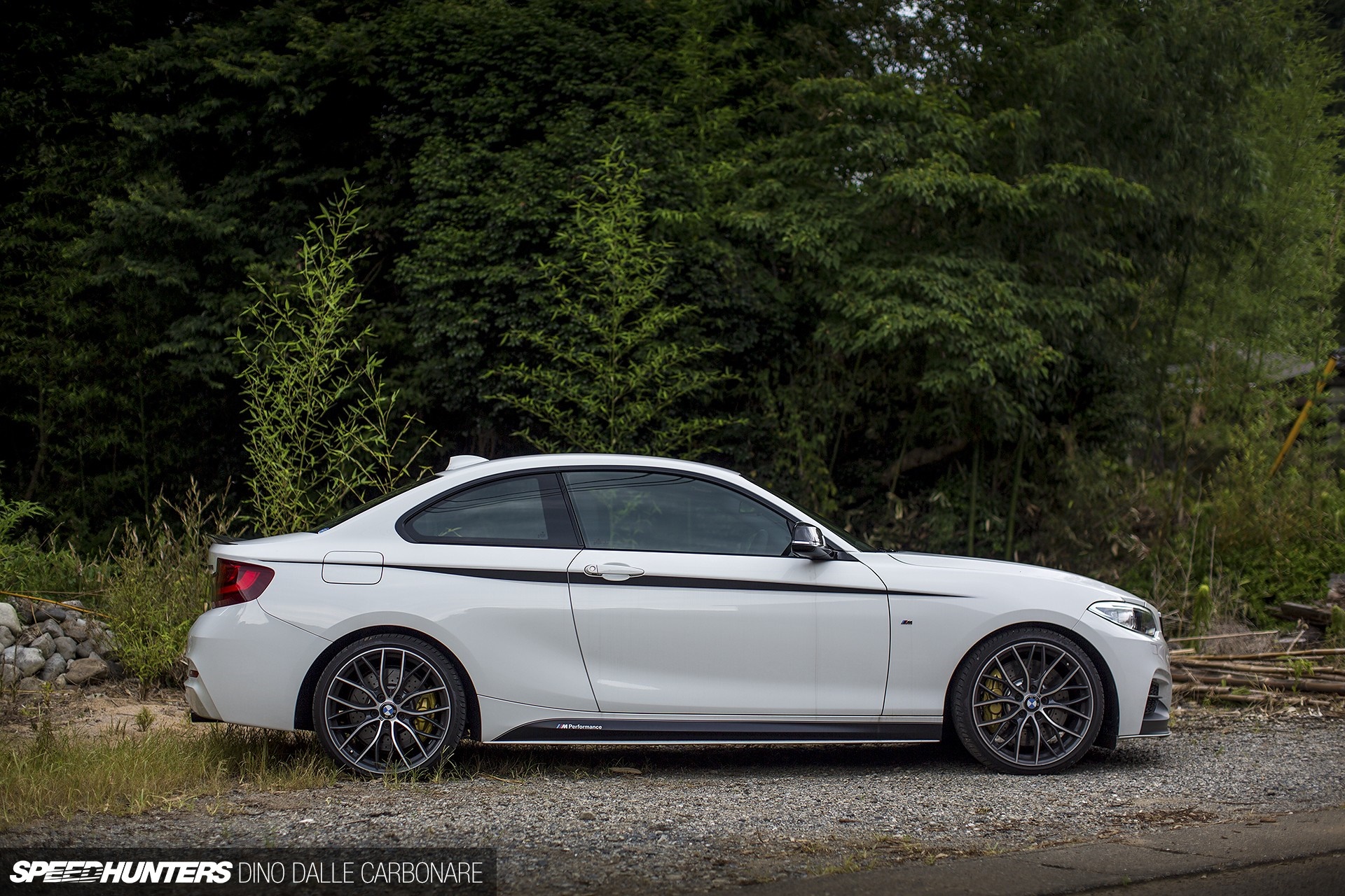White BMW M235i Coupe parked by trees HD Wallpaper