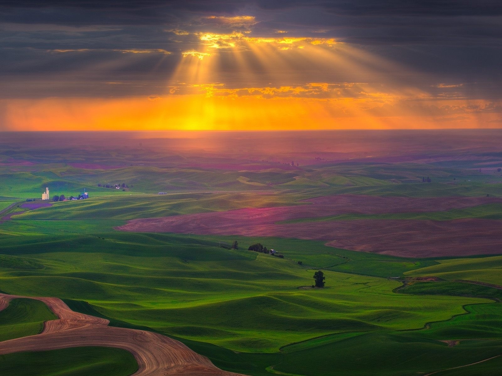 Sunset over rolling hills and fields HD Wallpaper