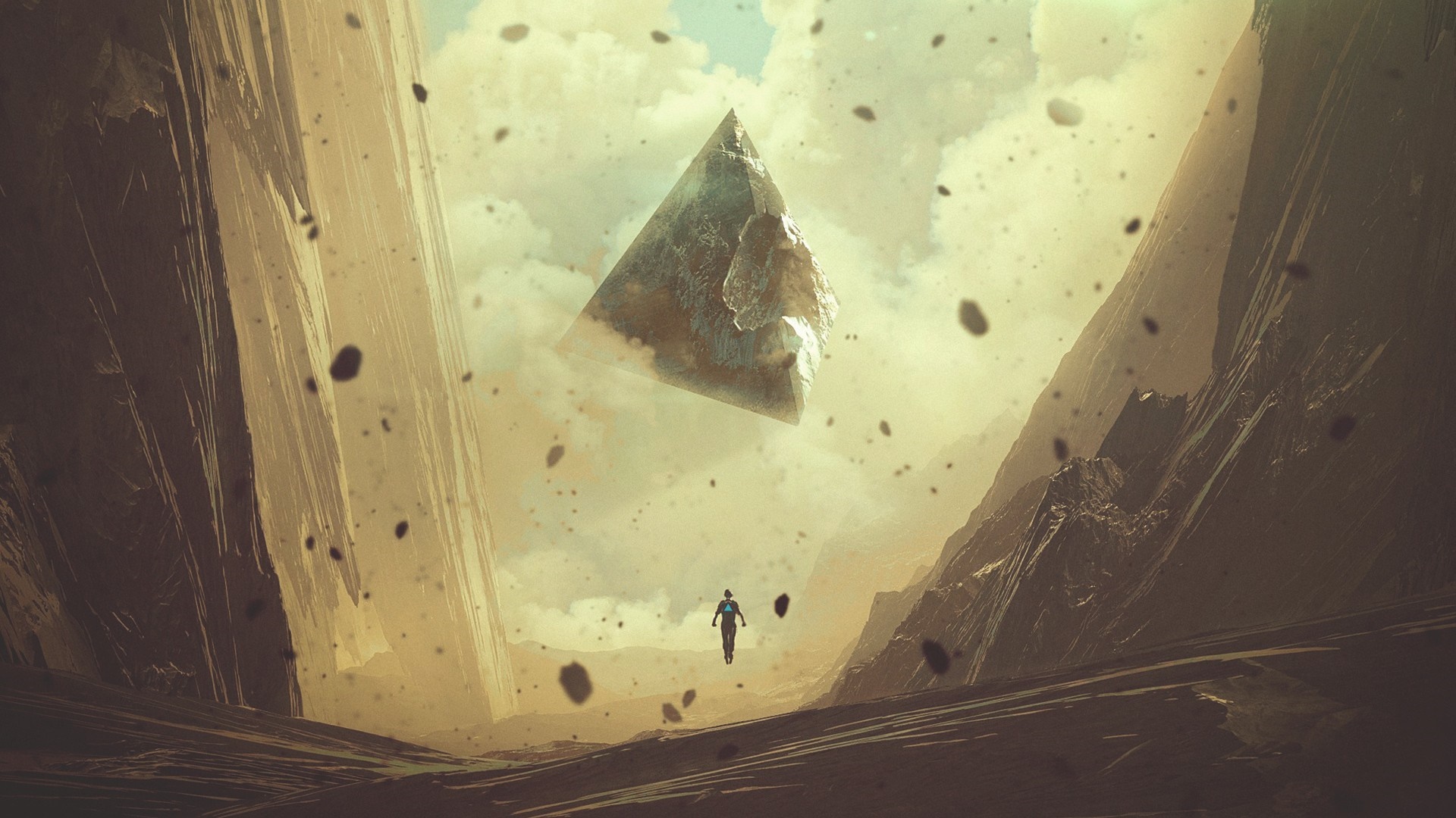A lone figure walks beneath a floating pyramid in a rocky canyon HD Wallpaper
