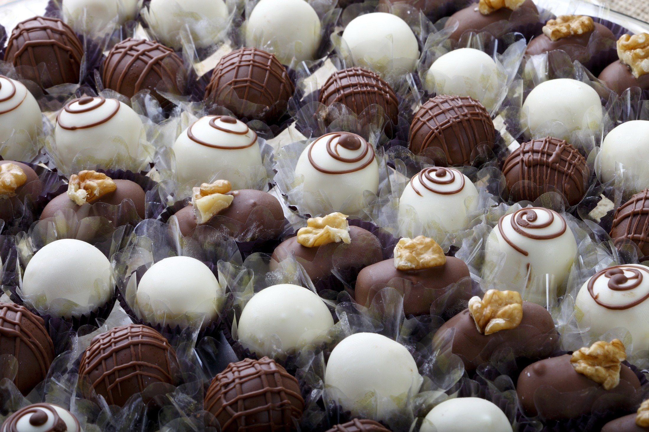 Assortment of chocolate truffles and bonbons HD Wallpaper