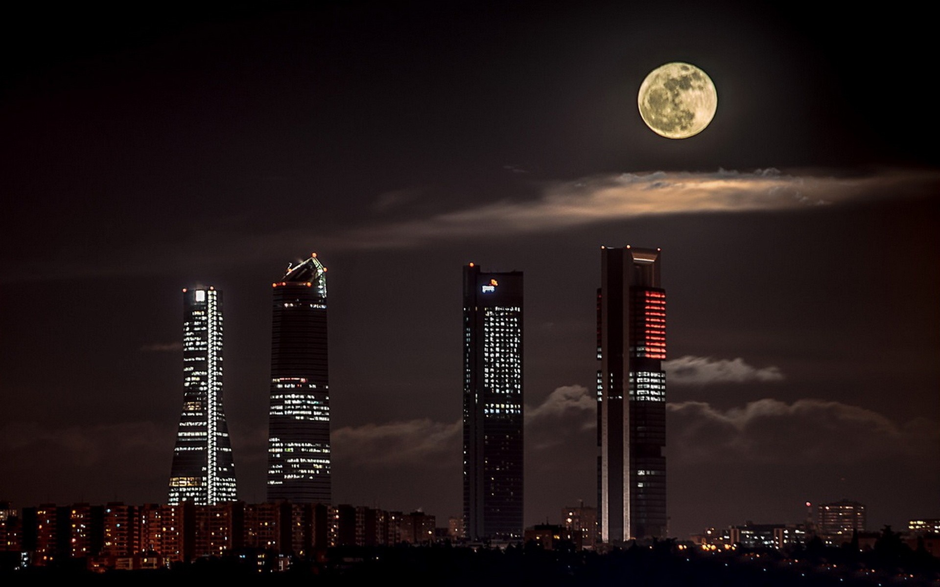 Cityscape with skyscrapers and full moon at night HD Wallpaper