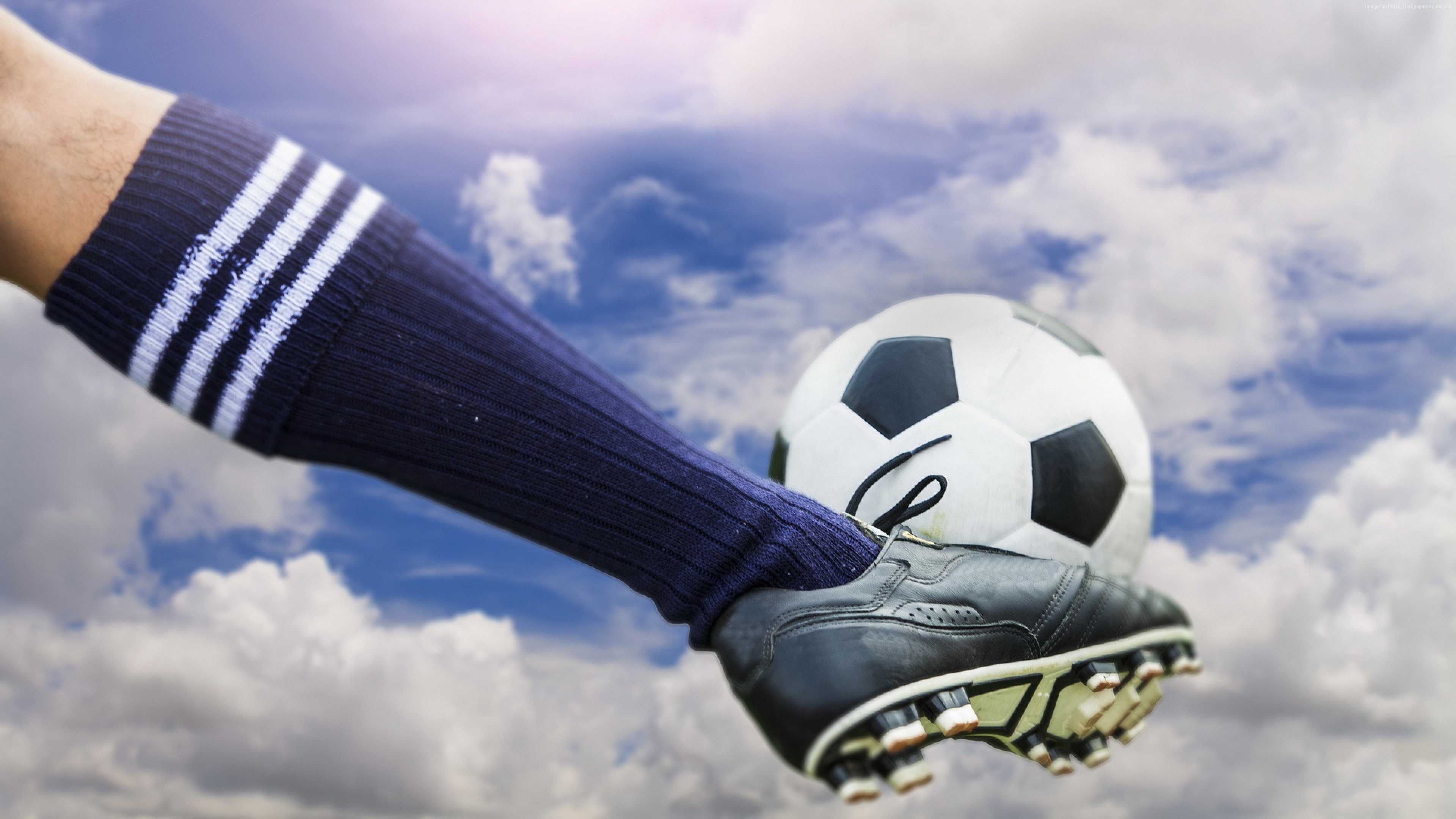 Soccer ball being kicked by a player HD Wallpaper