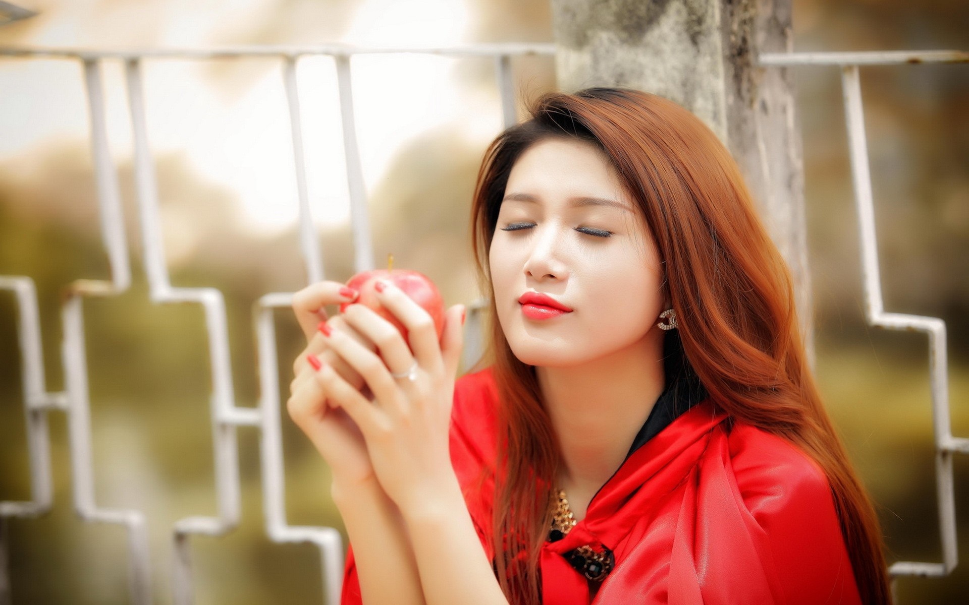 Asian woman in red holding an apple HD Wallpaper