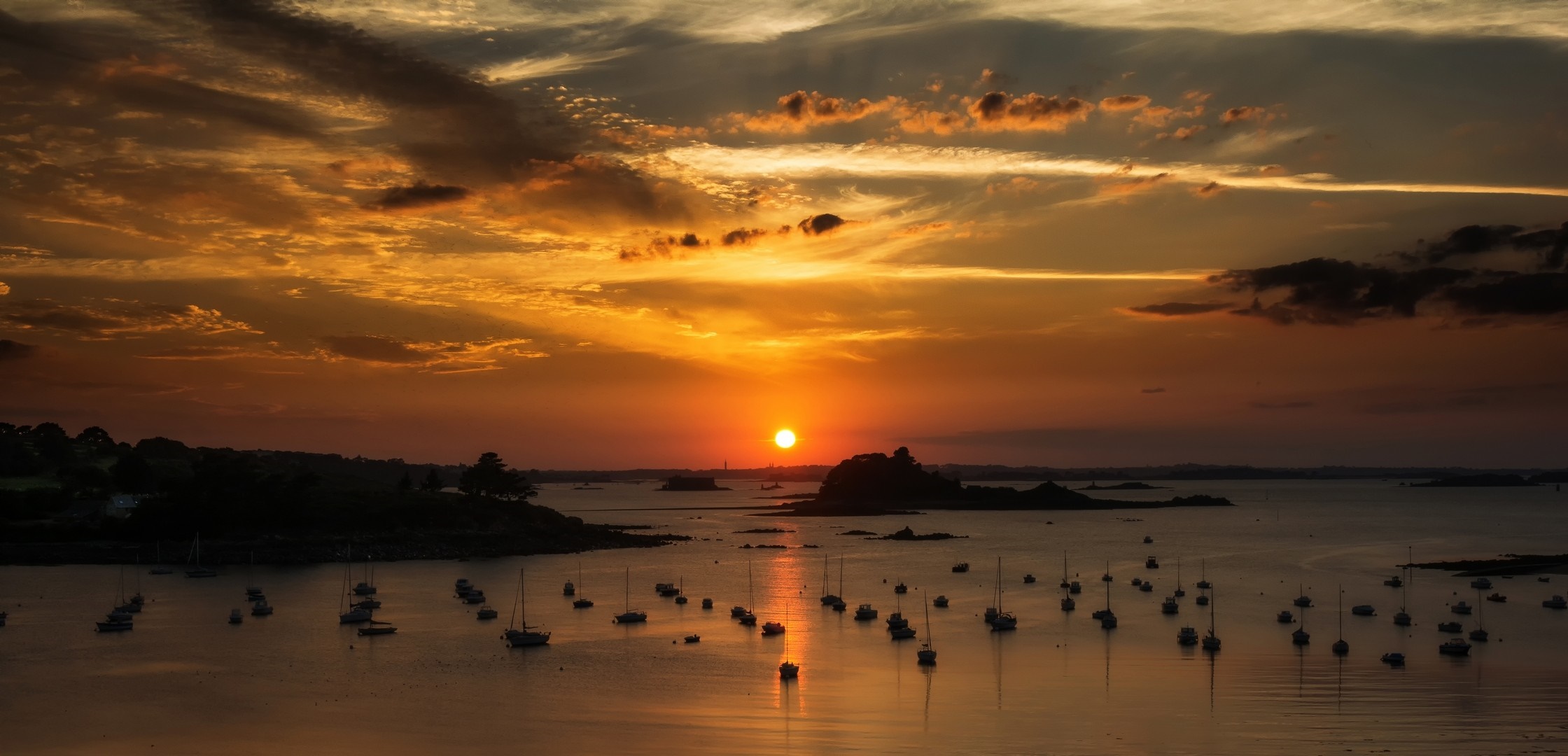 Sunset over a bay with sailboats HD Wallpaper