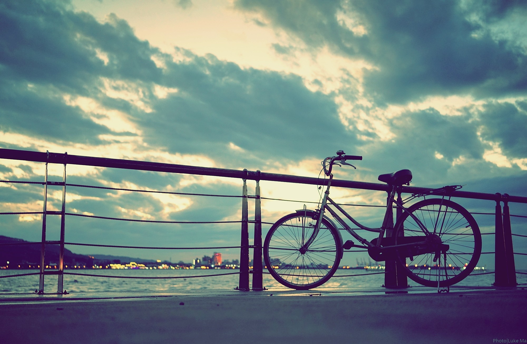 Bicycle on a pier at sunset HD Wallpaper