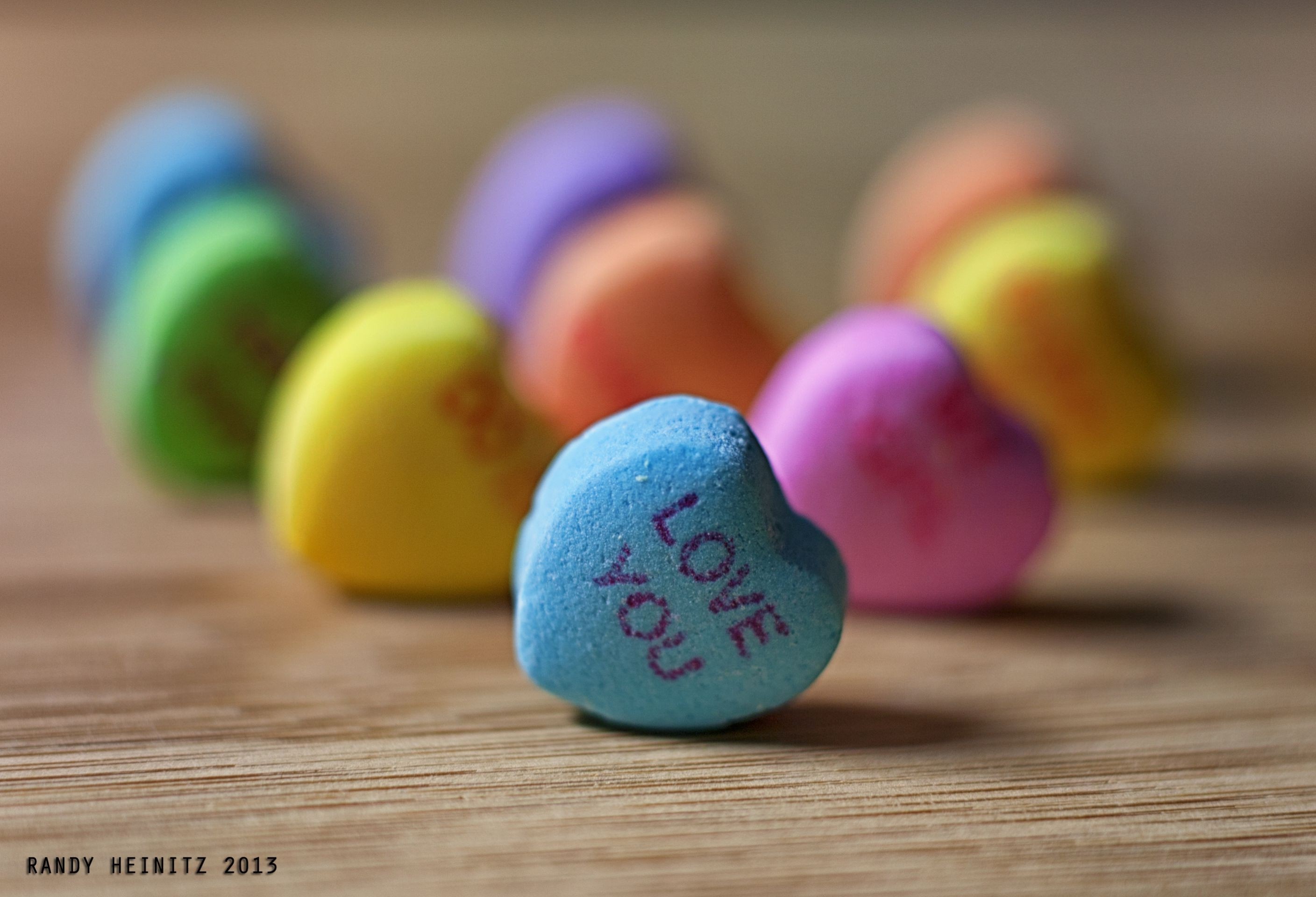 Heart-shaped candy with "Love You" message HD Wallpaper