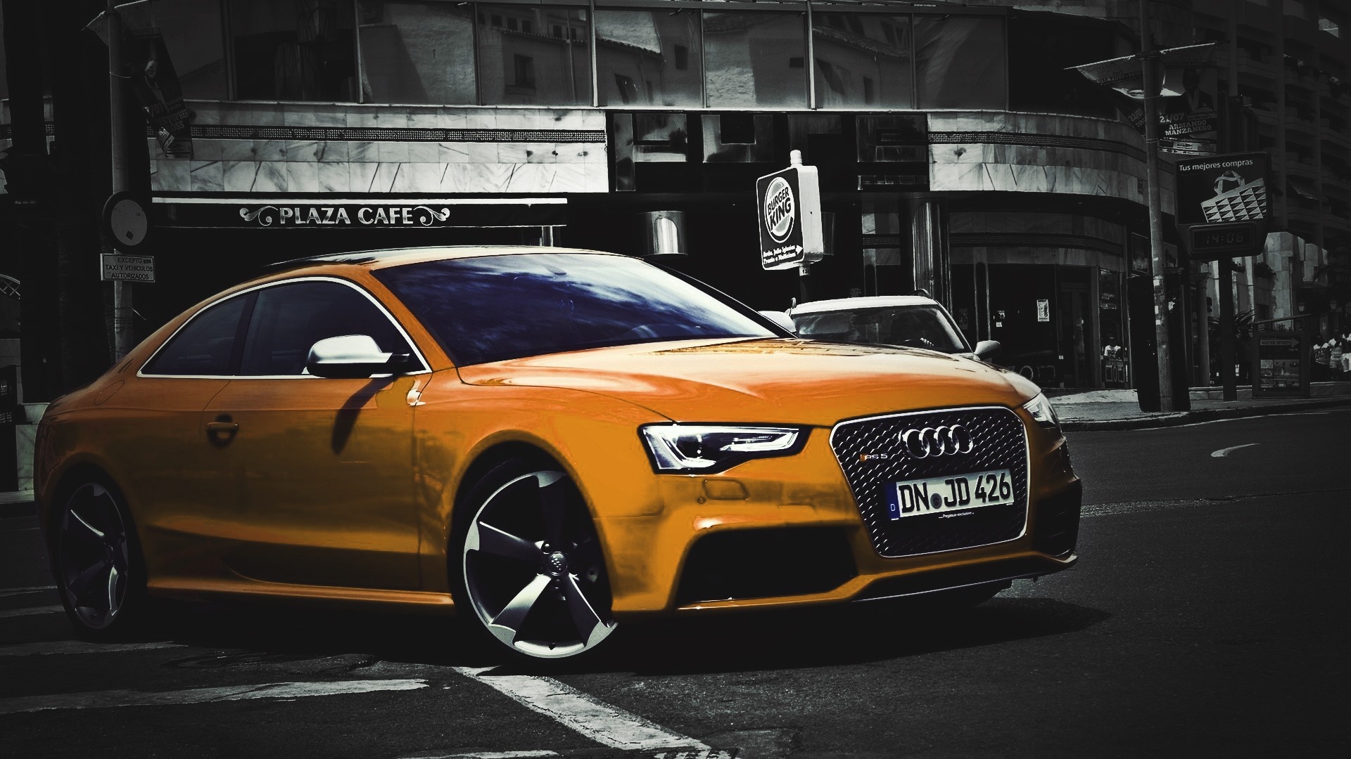 Orange Audi RS5 Coupe parked on a city street HD Wallpaper