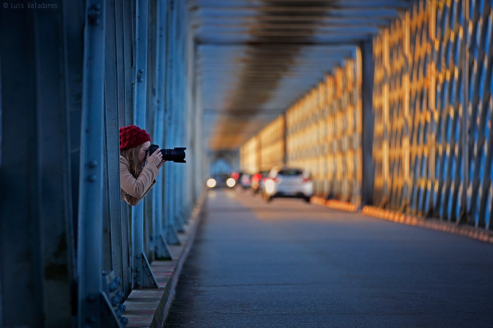 Woman with camera on a bridge at sunset HD Wallpaper