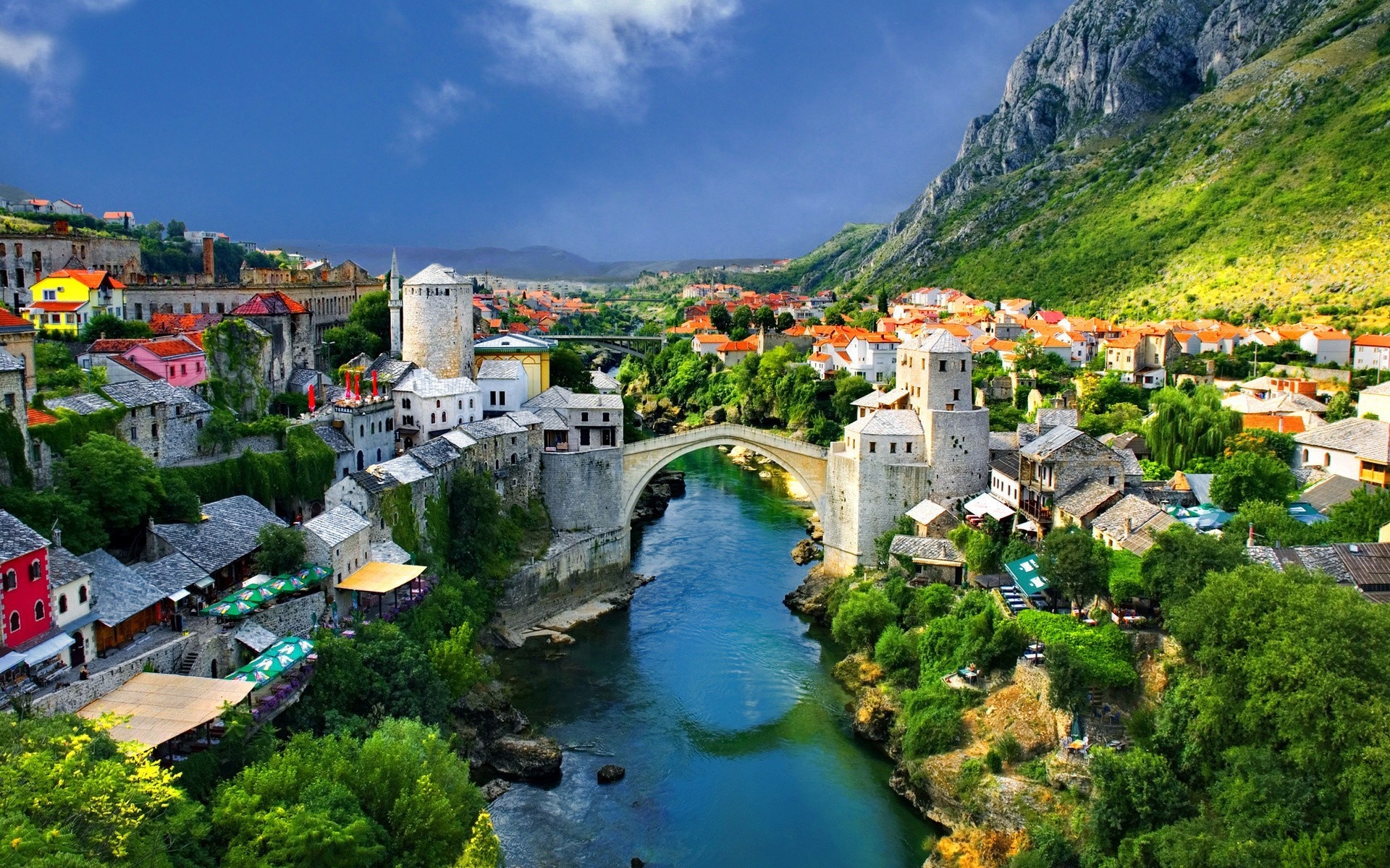 Mostar cityscape with a river and a stone bridge HD Wallpaper