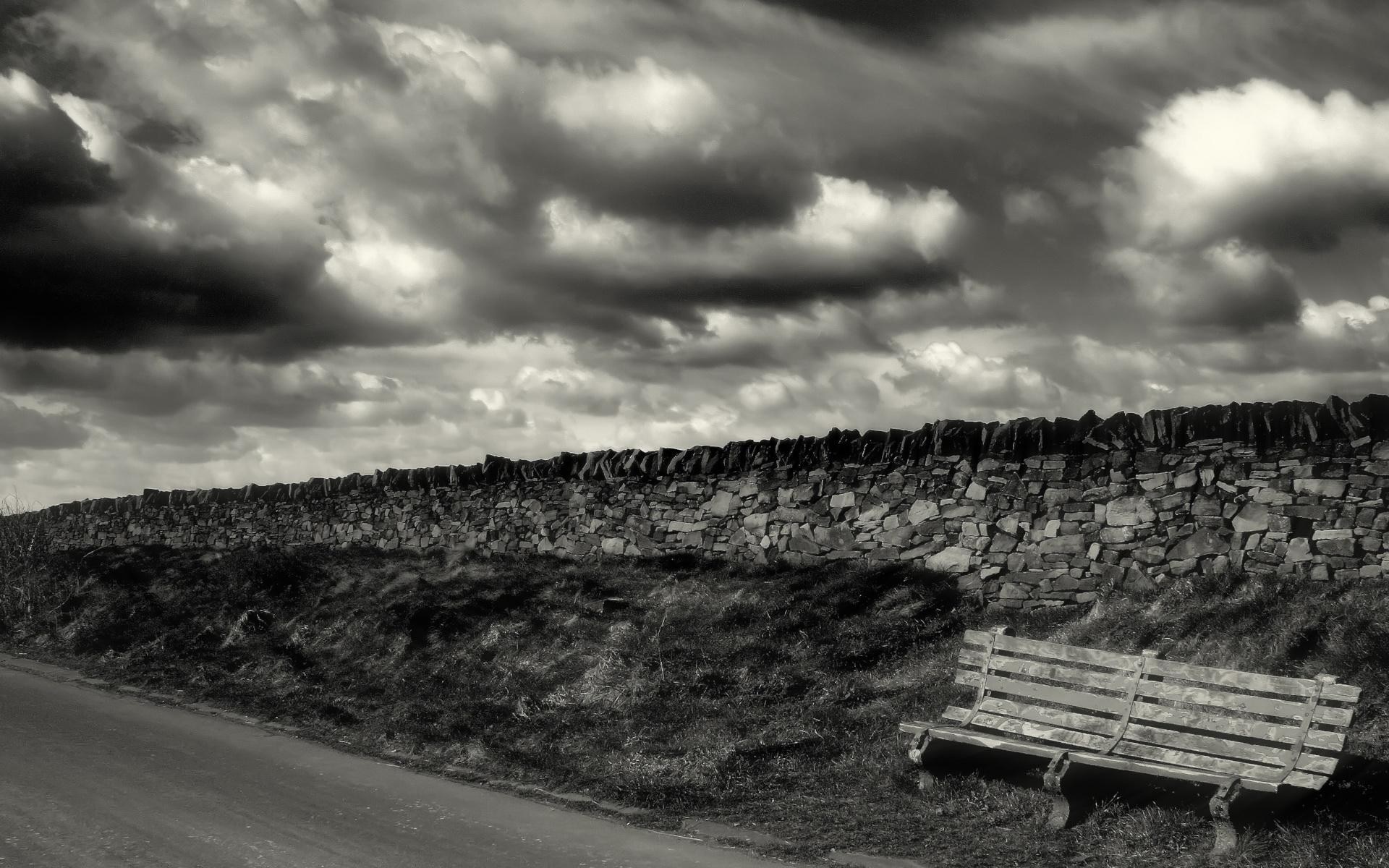 Monochrome rural landscape with stone wall and bench HD Wallpaper