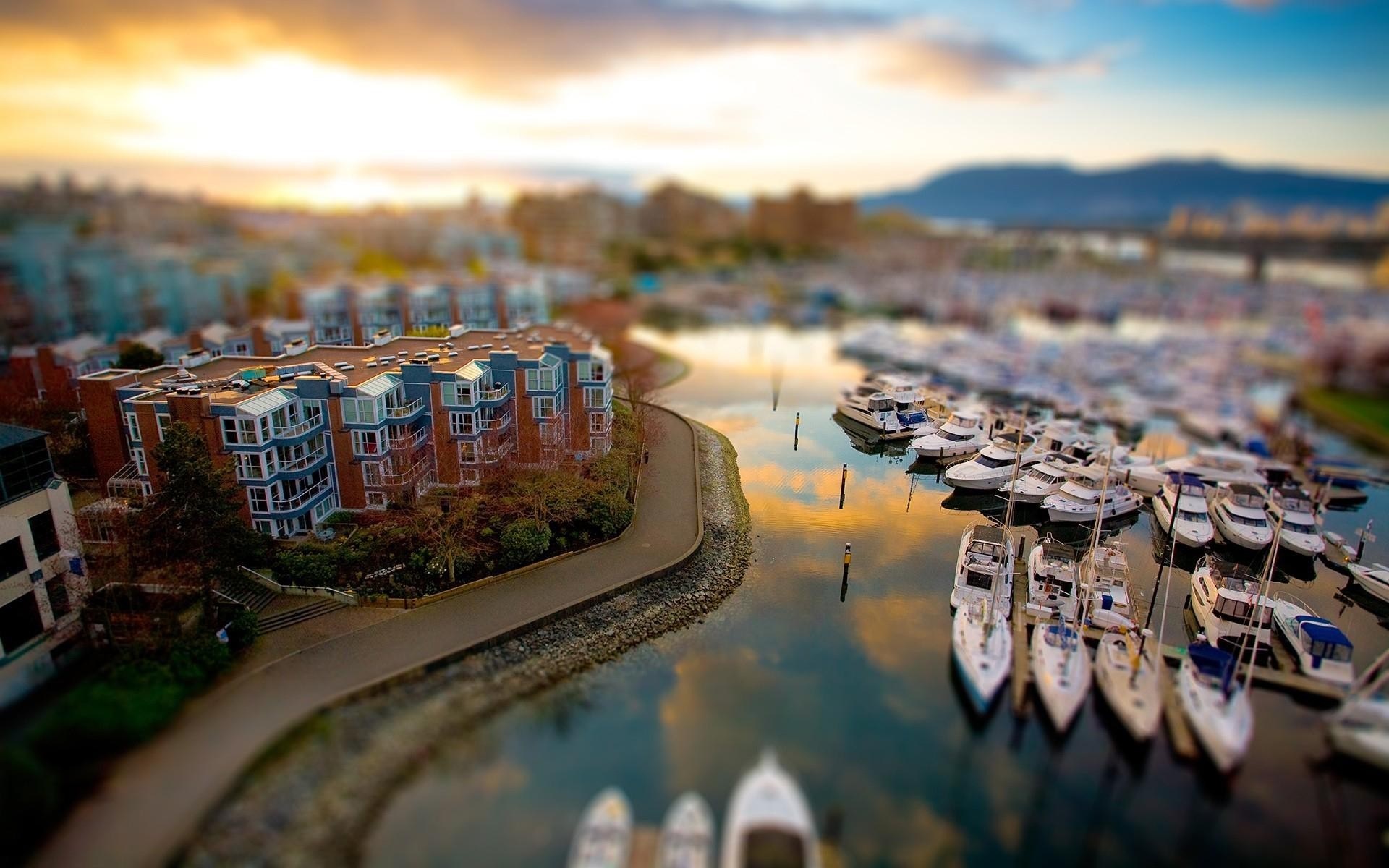 Apartment buildings and boats in a marina at sunset HD Wallpaper