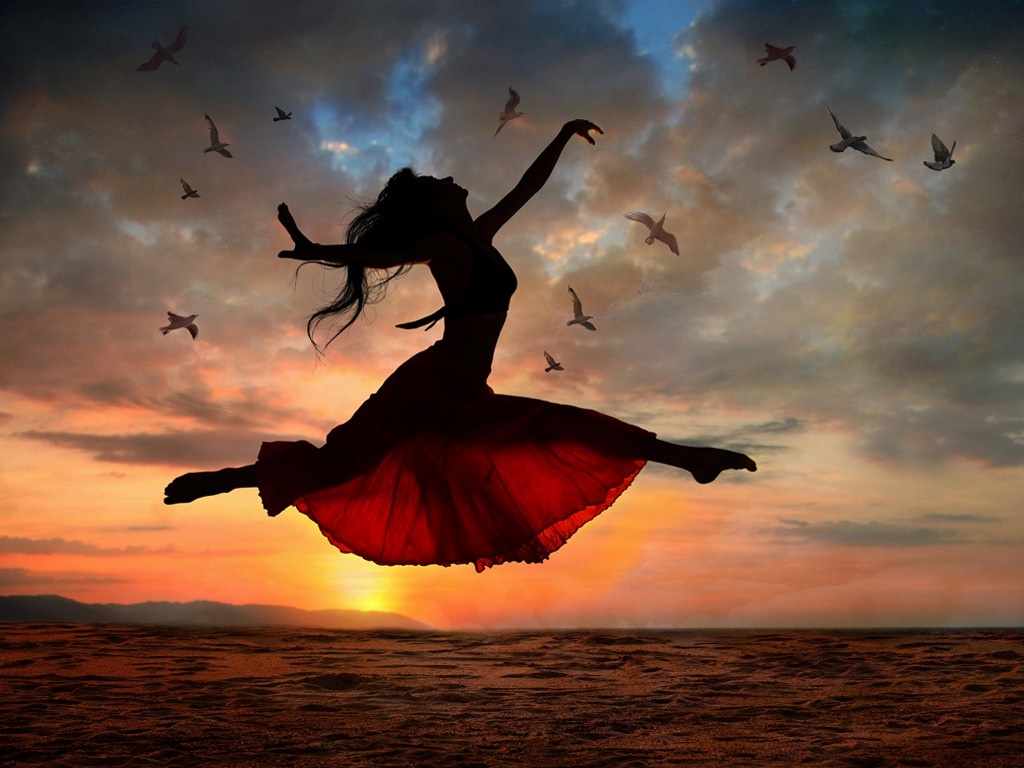 Silhouette of a dancer jumping at sunset with birds HD Wallpaper