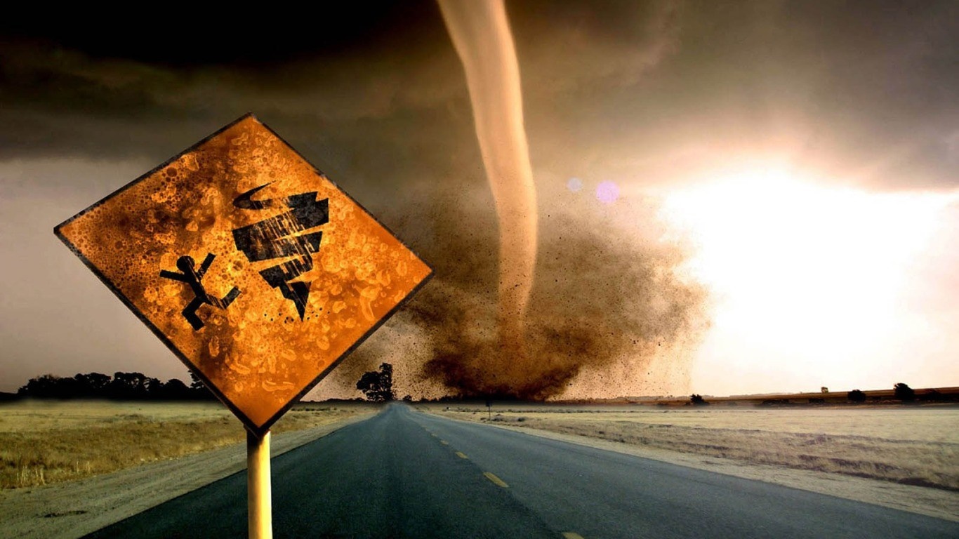 Tornado warning sign on a road HD Wallpaper