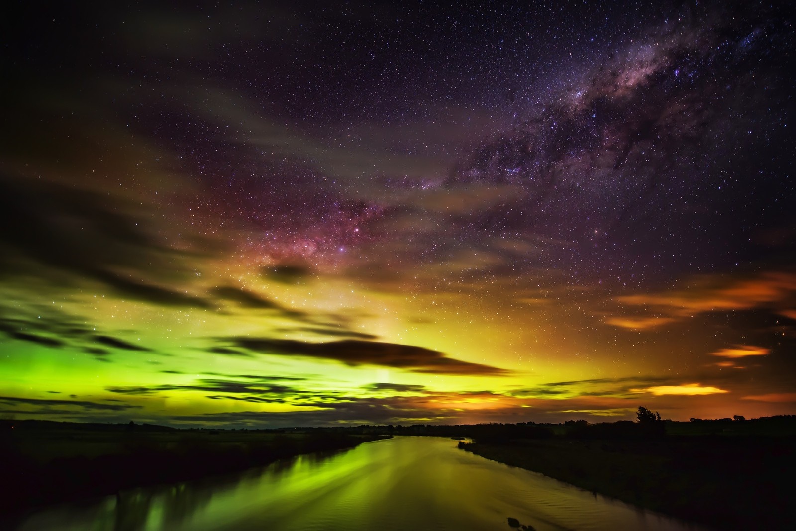 Aurora Borealis over a river at night HD Wallpaper