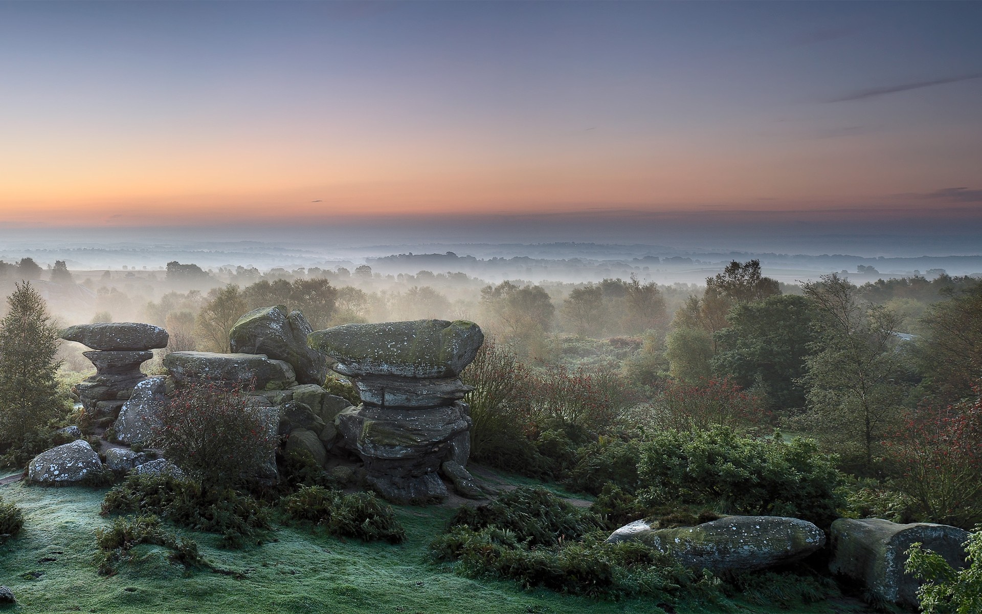 Misty morning landscape with rock formations at sunrise HD Wallpaper