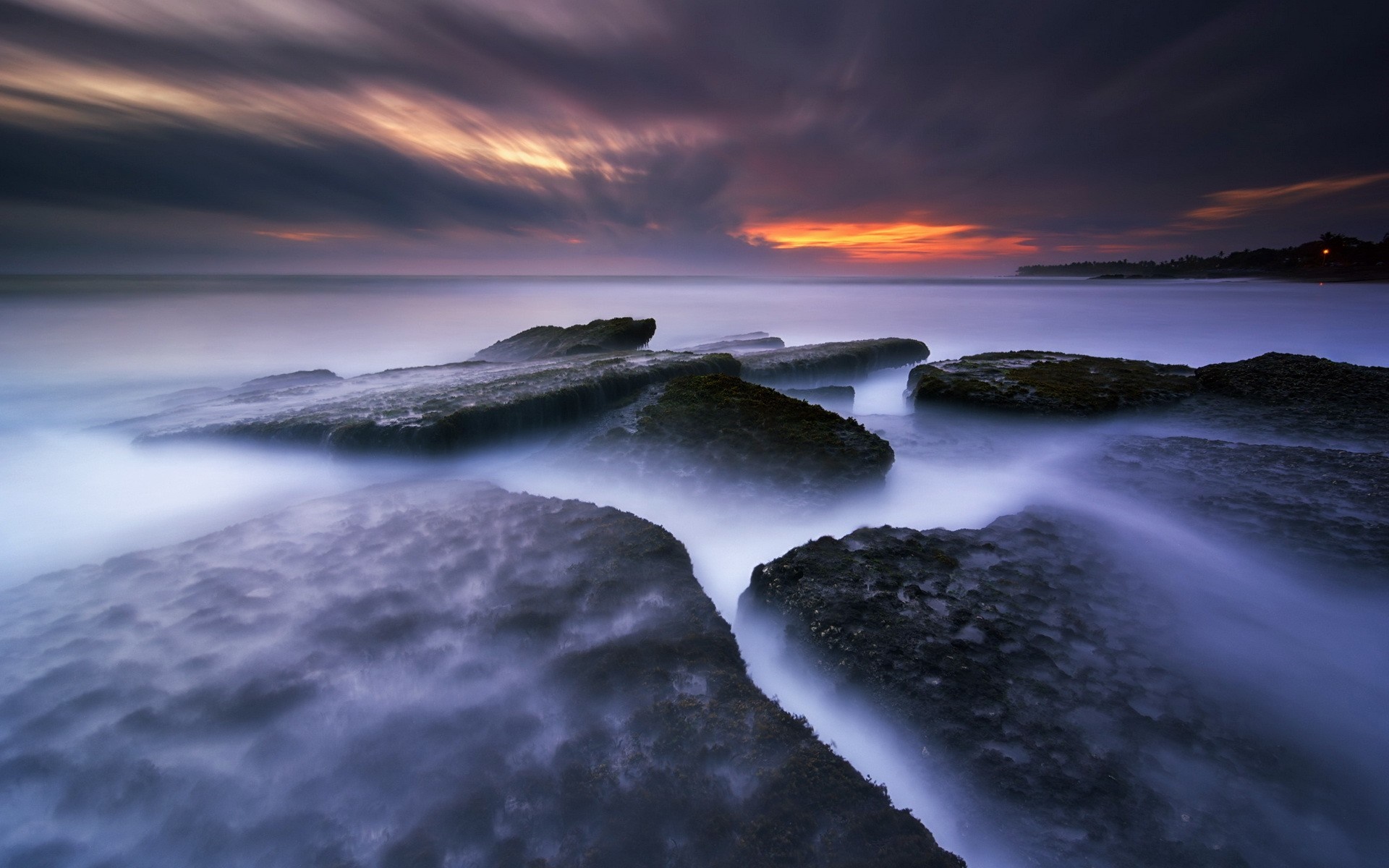 Long exposure of rocks and sea at sunset HD Wallpaper
