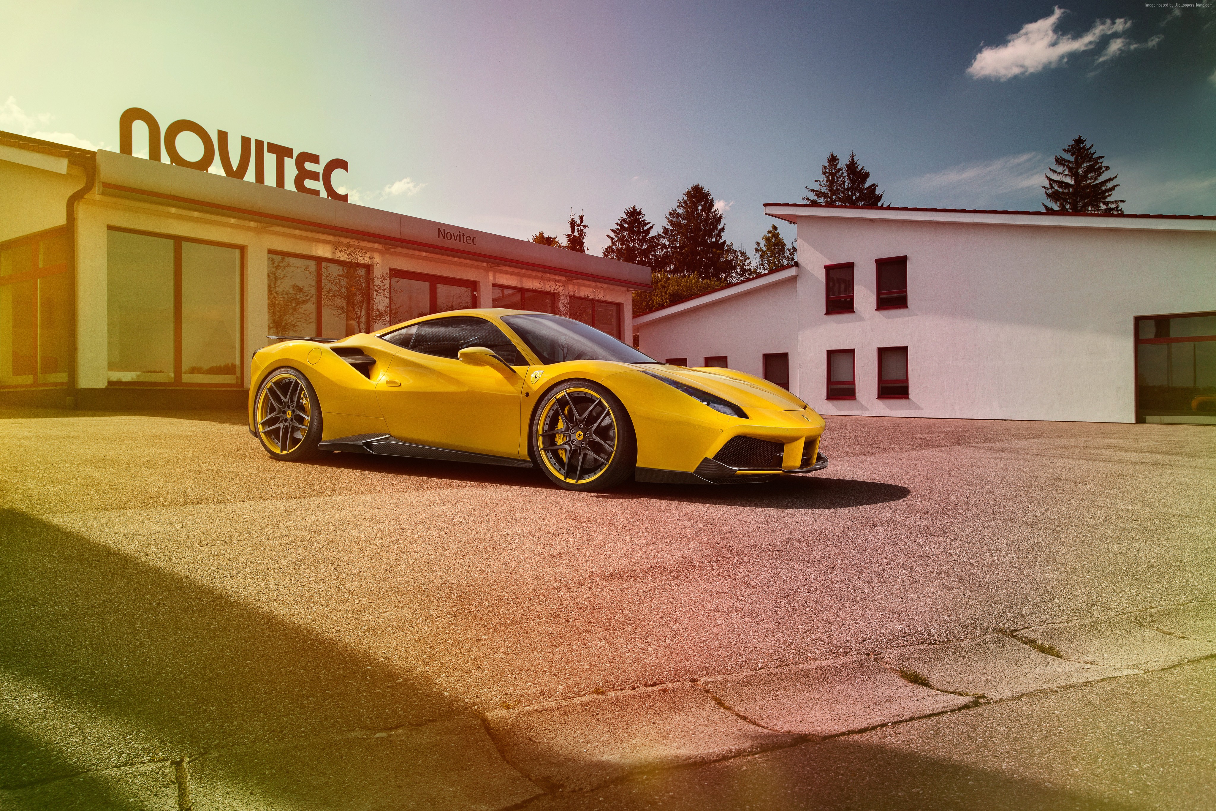 Yellow NOVITEC Ferrari 488 GTB parked outside building HD Wallpaper