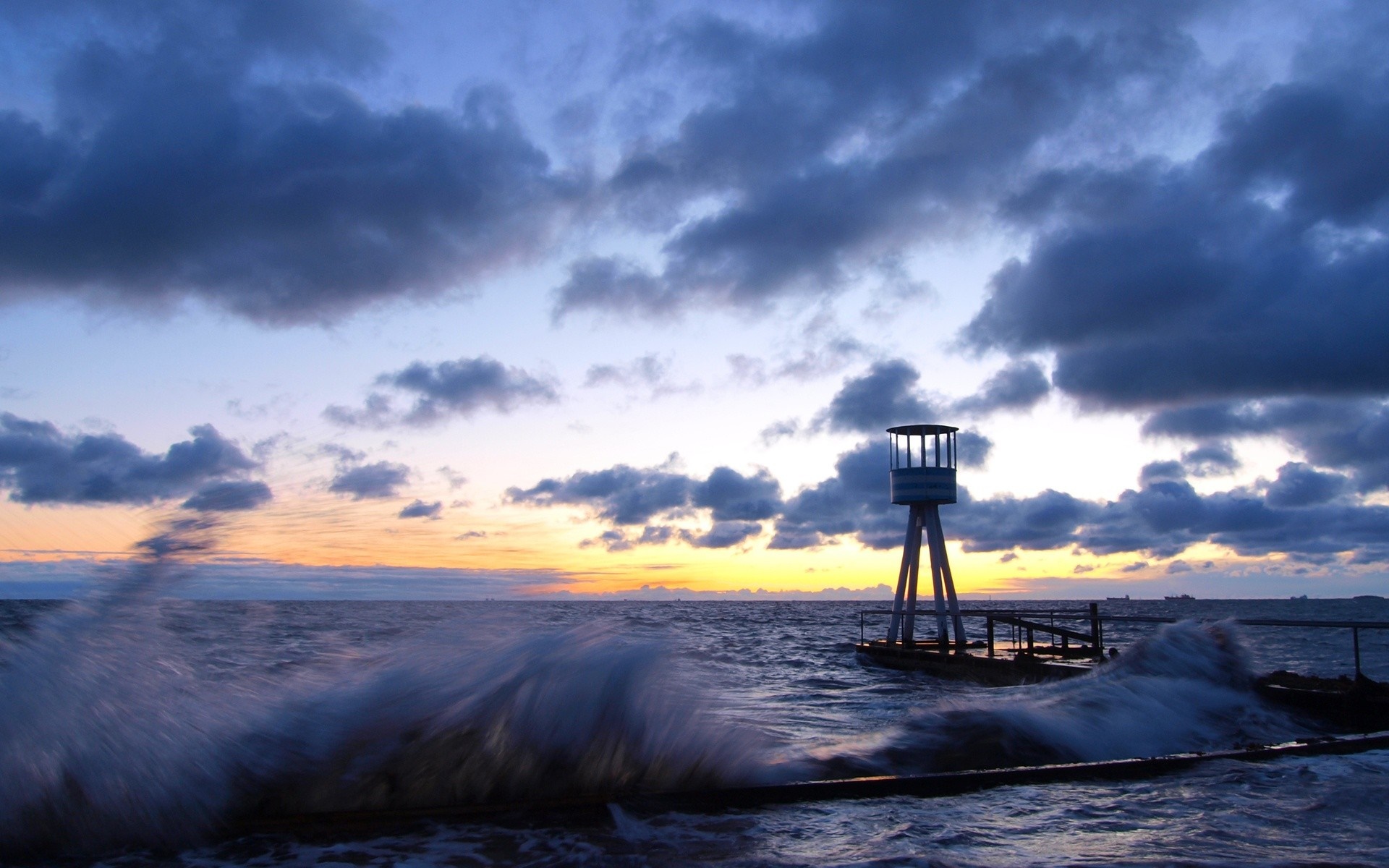 Lifeguard tower on the sea at sunset with waves HD Wallpaper