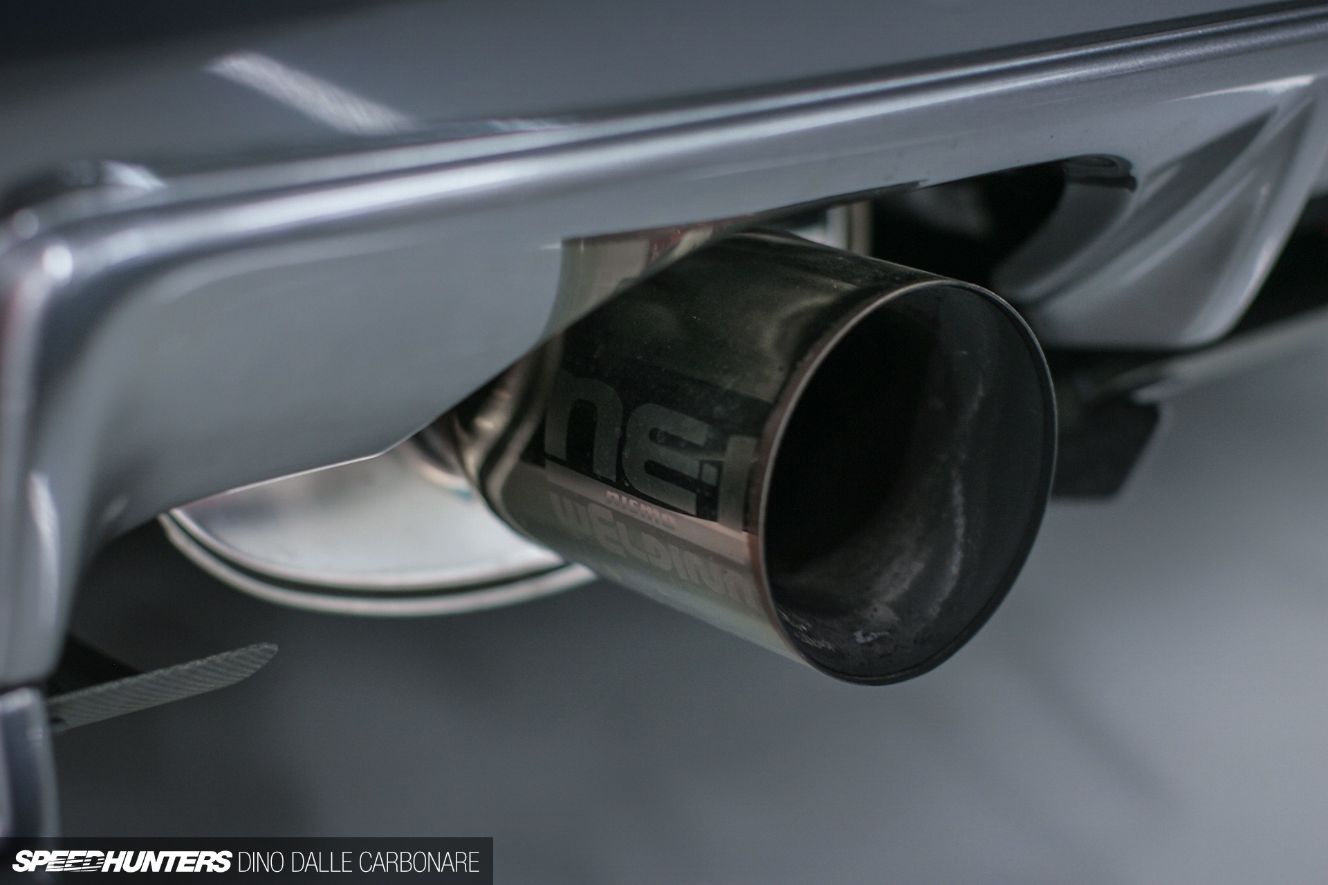 Nissan Skyline GT-R R34 exhaust pipe with brand logo HD Wallpaper
