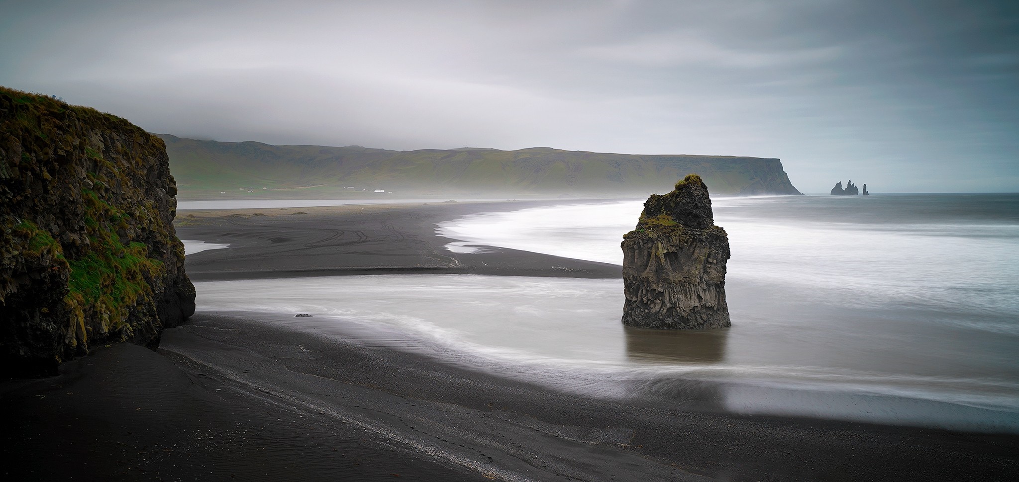 Black sand beach with sea stacks and cliffs HD Wallpaper