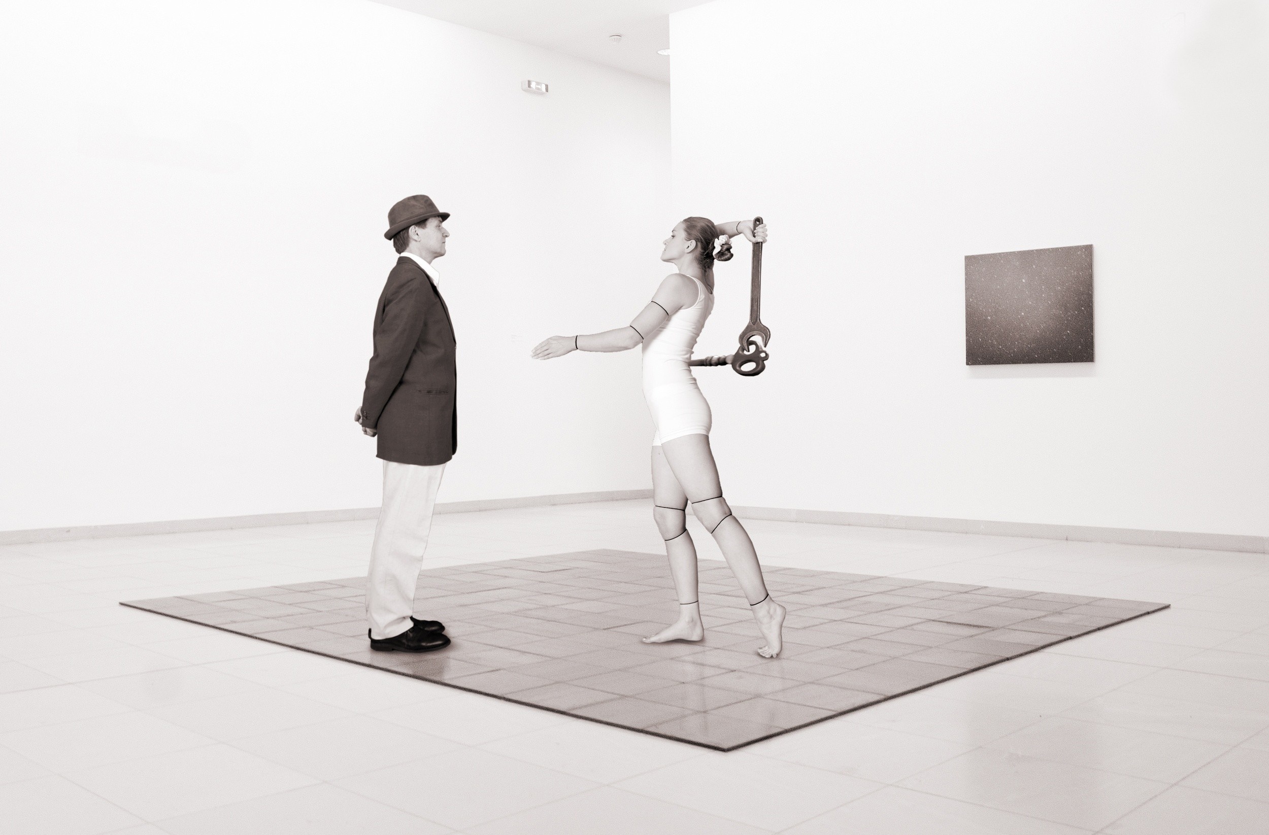Mannequin holding a wrench in an art gallery HD Wallpaper