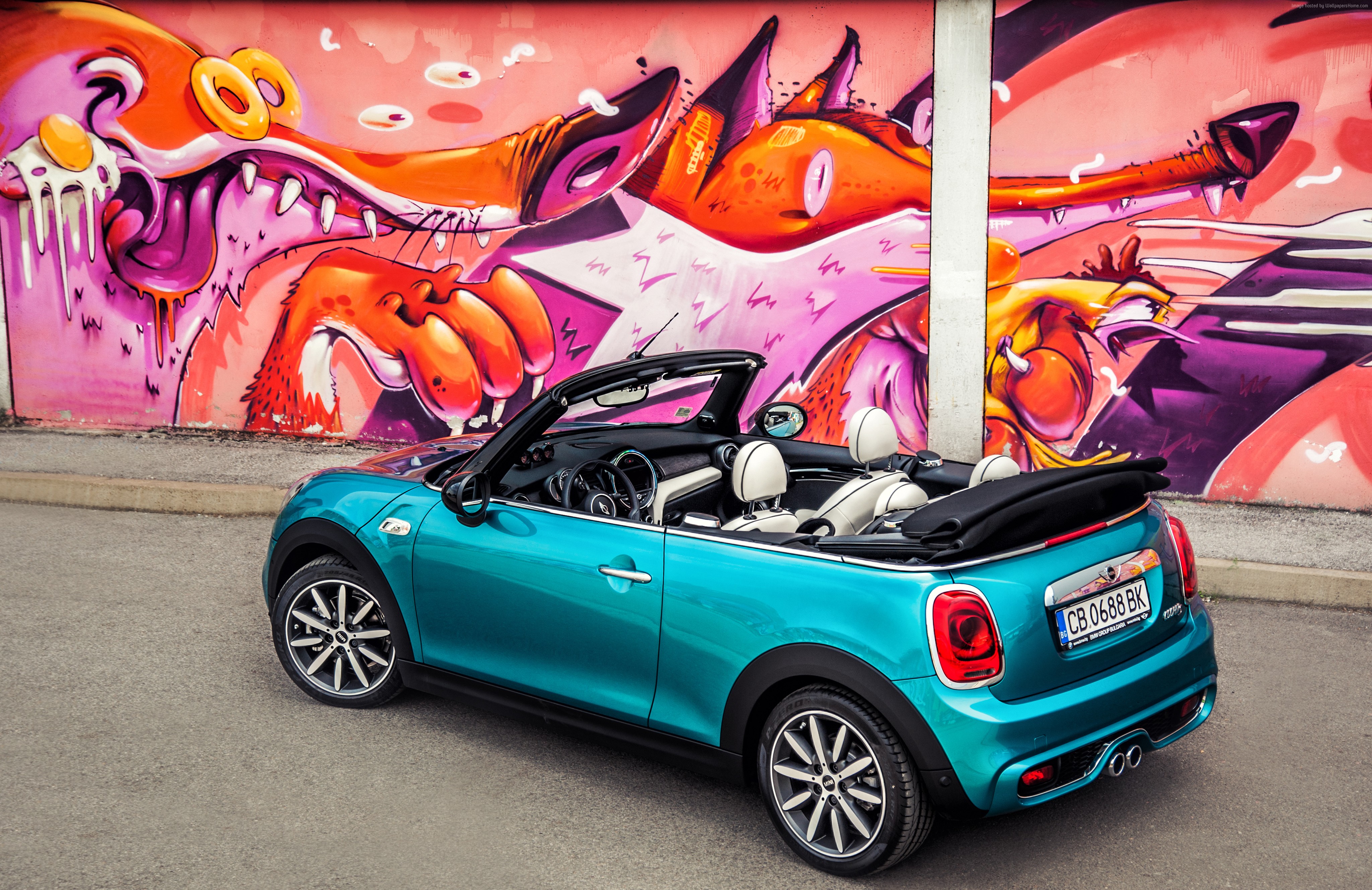 Blue Mini Cooper S Cabrio parked in front of graffiti wall HD Wallpaper