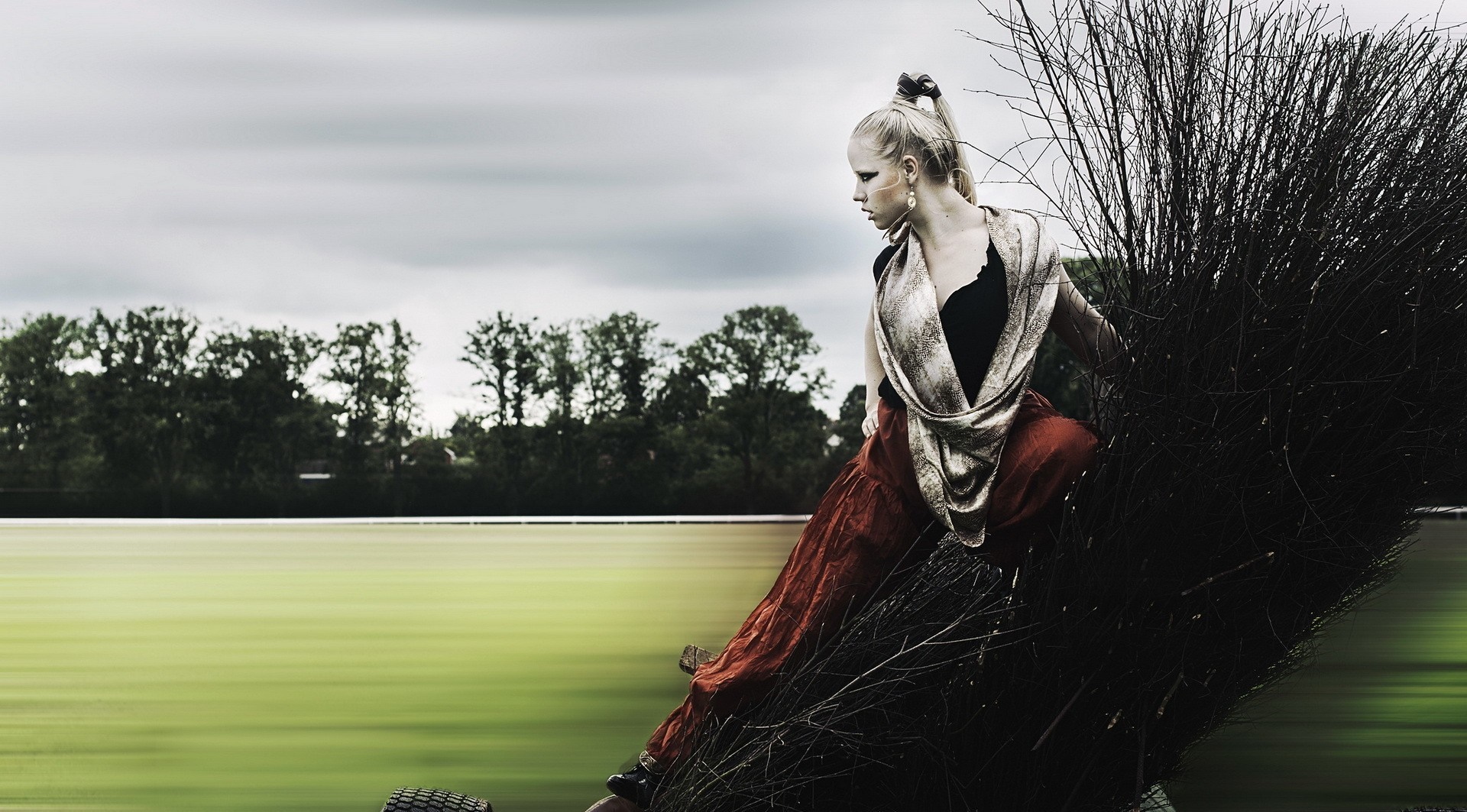 Woman in red skirt and scarf posing outdoors HD Wallpaper