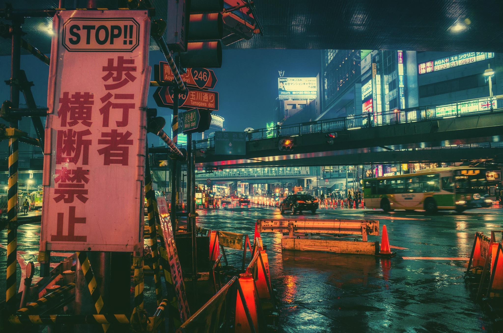 Nighttime Tokyo street with stop sign and bus HD Wallpaper