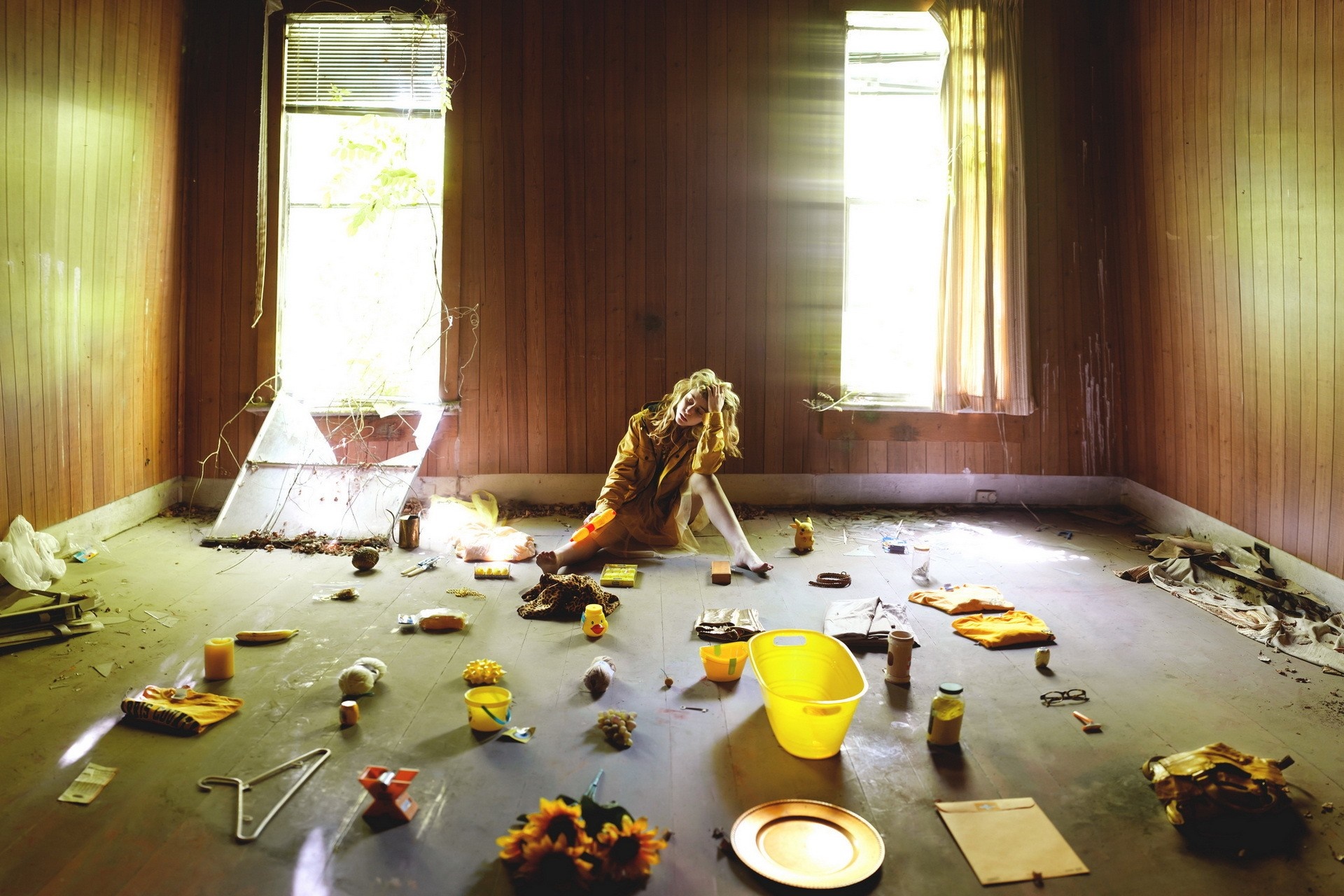 Woman sitting in a cluttered abandoned room HD Wallpaper
