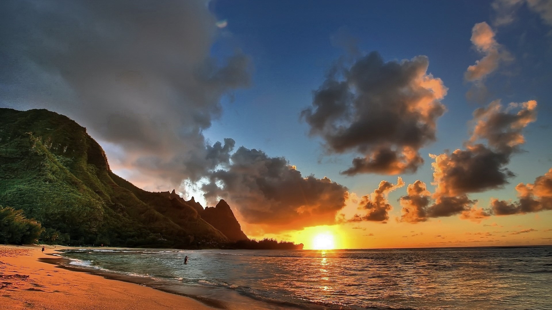 Sunset over a tropical beach with mountains HD Wallpaper
