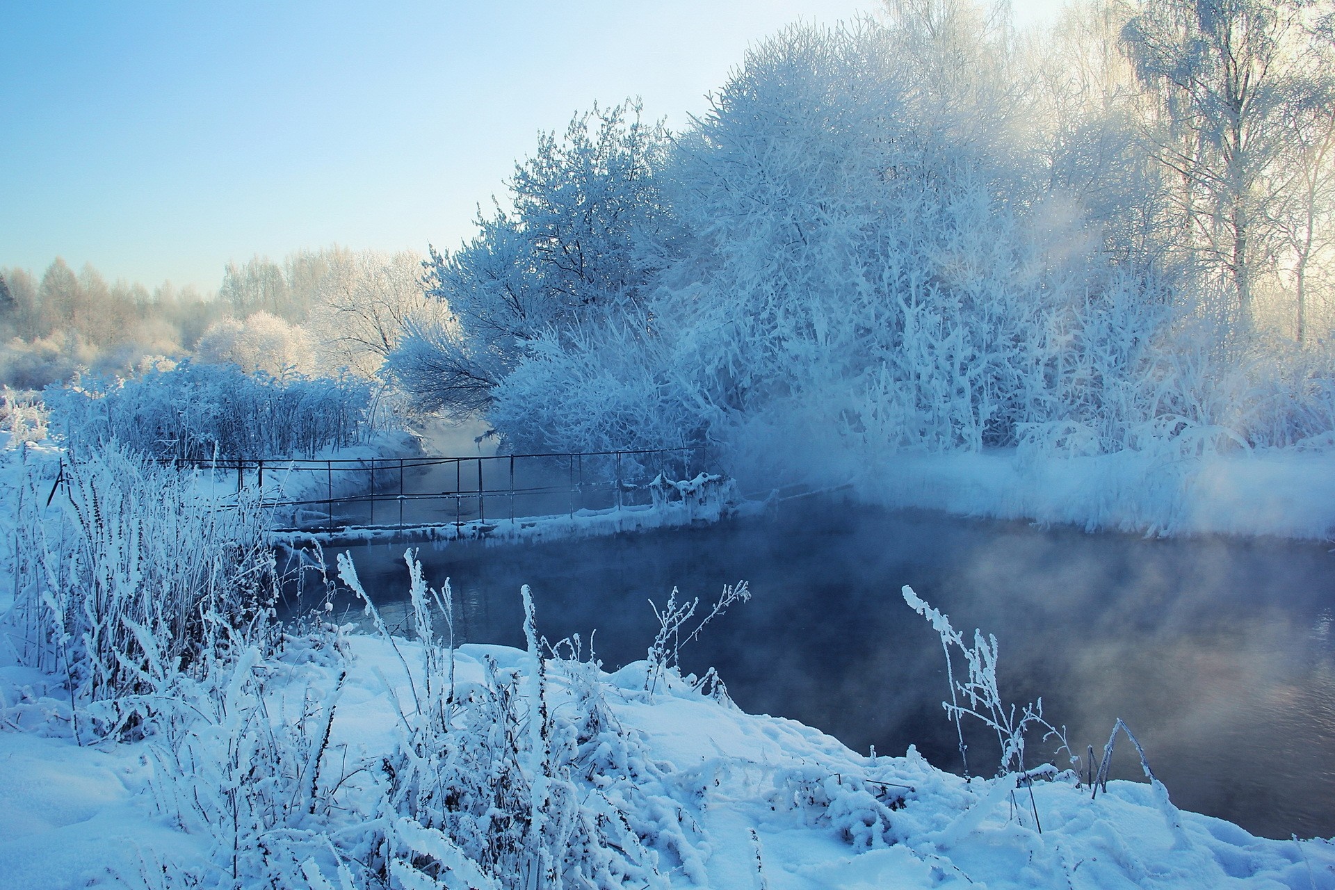 Winter landscape with a frozen river and mist HD Wallpaper