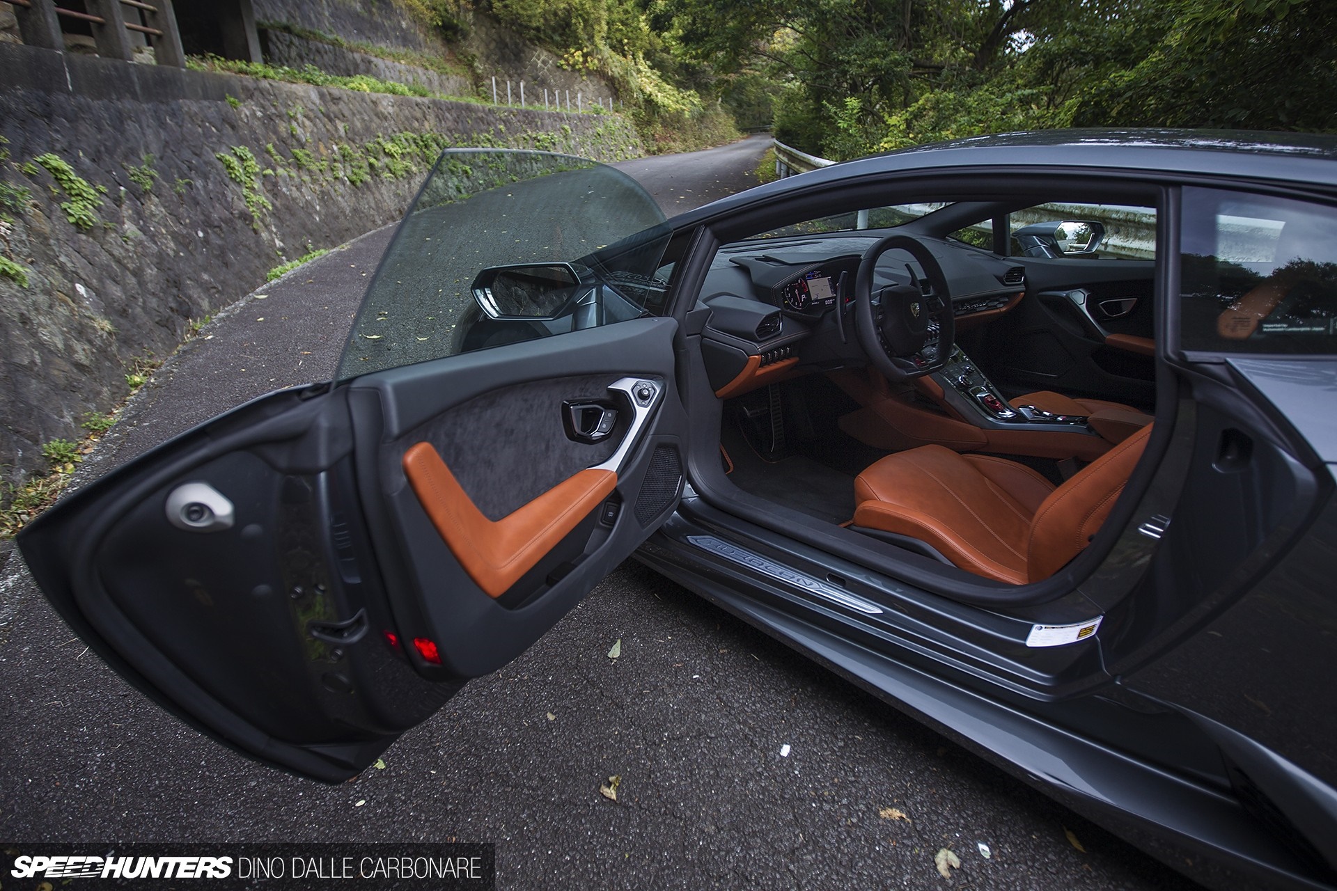 Lamborghini Huracan interior and exterior on a winding road HD Wallpaper