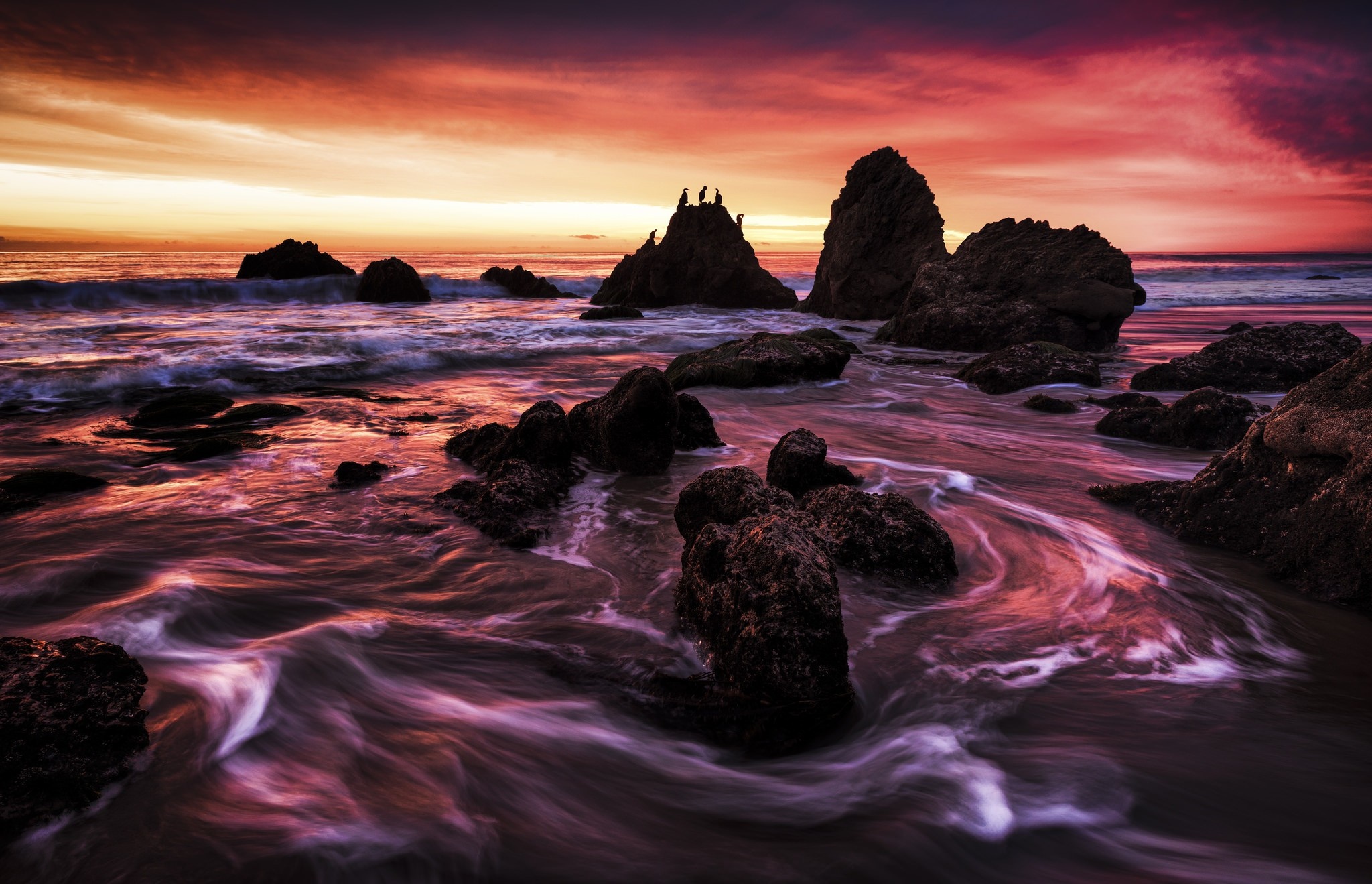 Sunset over rocky coast with waves HD Wallpaper