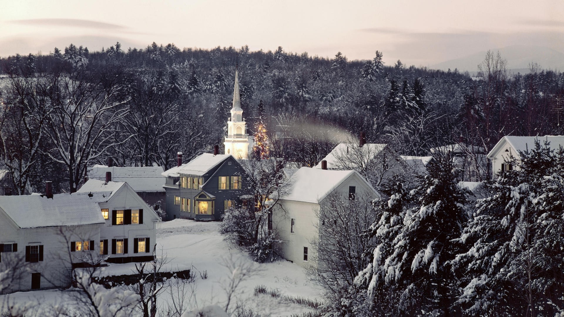 Snowy village with church and Christmas tree HD Wallpaper