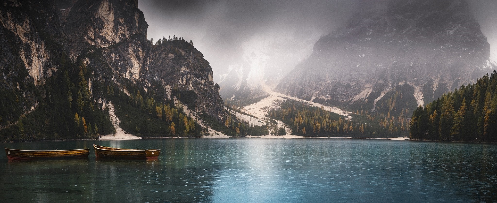 Two boats on a lake with mountains and mist HD Wallpaper