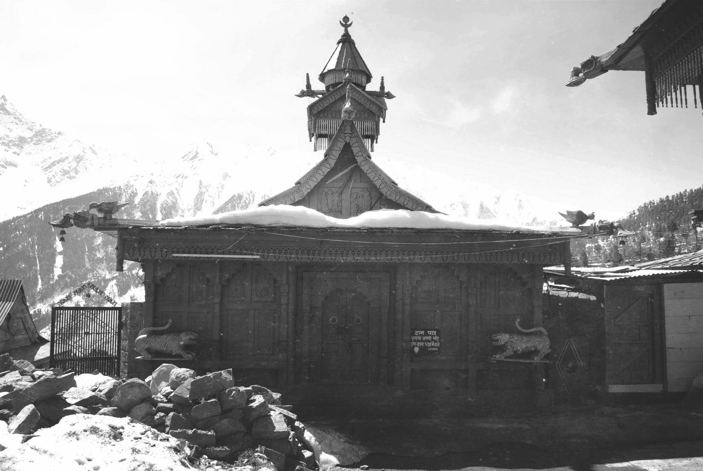 Wooden temple with snow-capped mountains in the background HD Wallpaper