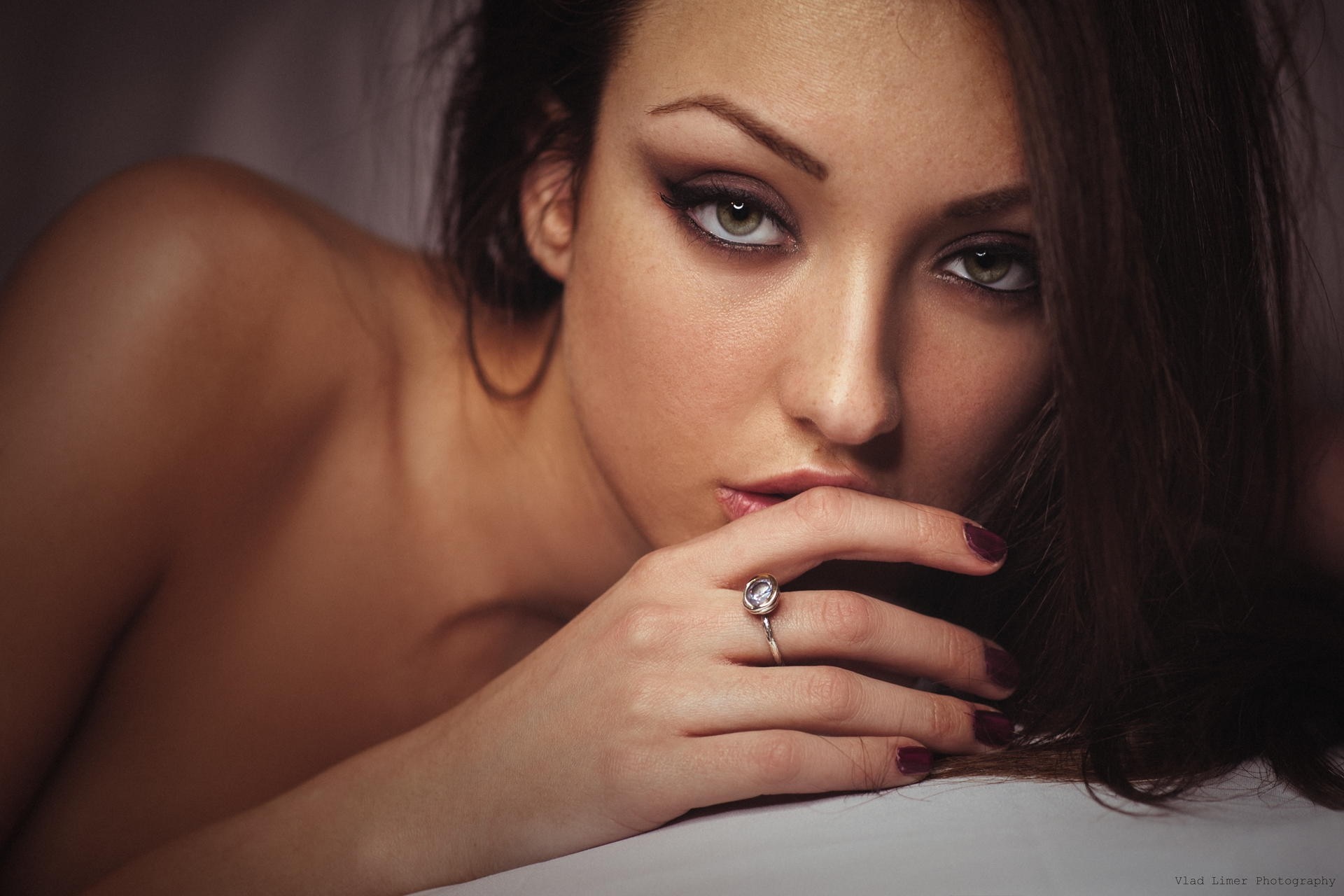 Close up portrait of a woman with dark hair HD Wallpaper