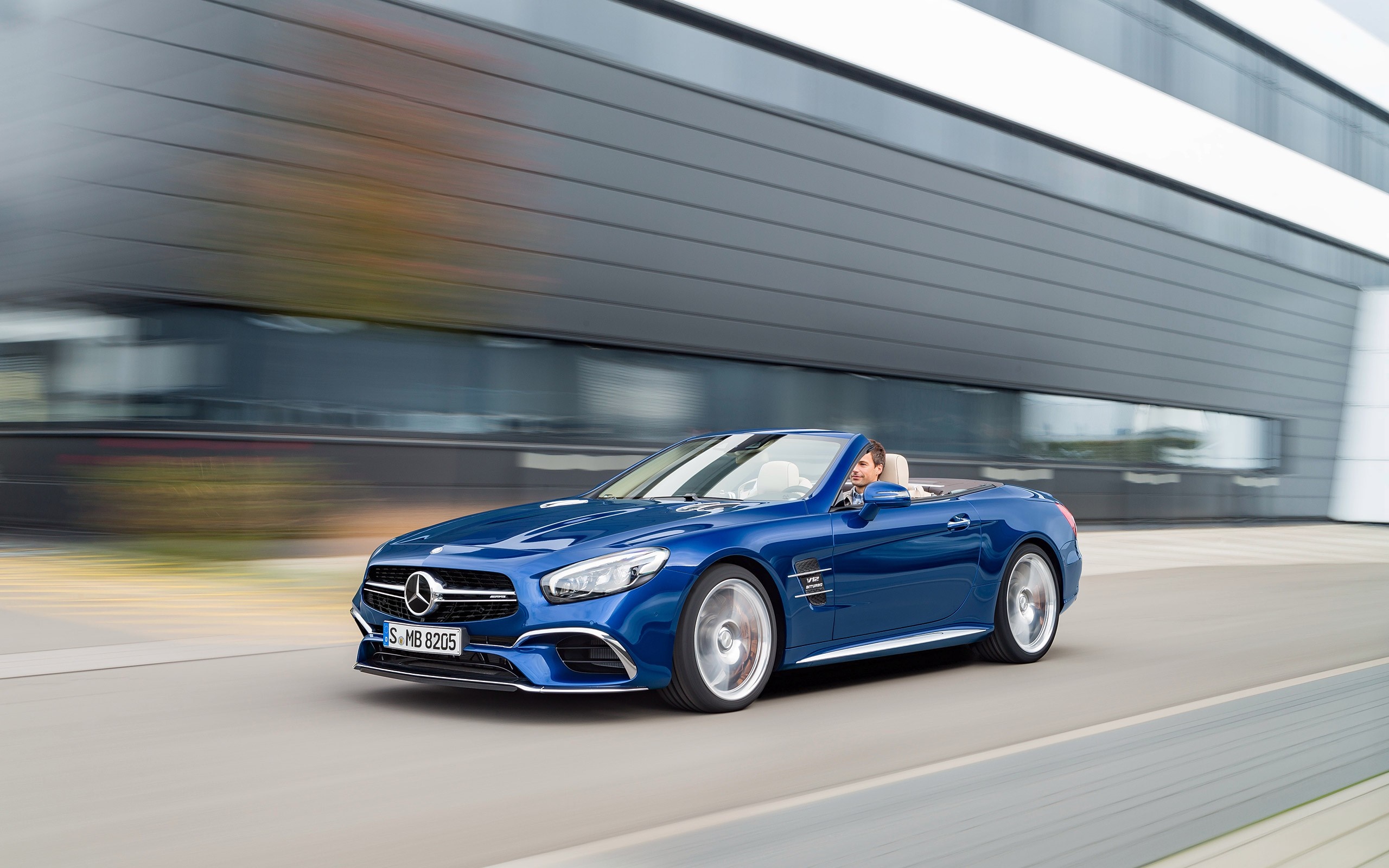 Blue Mercedes-Benz SL65 AMG Convertible driving on road HD Wallpaper
