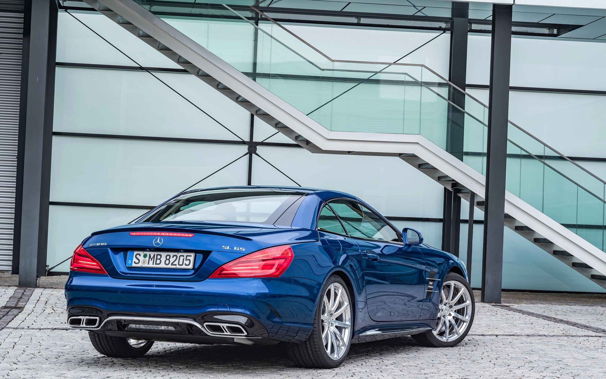 Blue Mercedes Benz SL65 AMG parked outside modern building HD Wallpaper