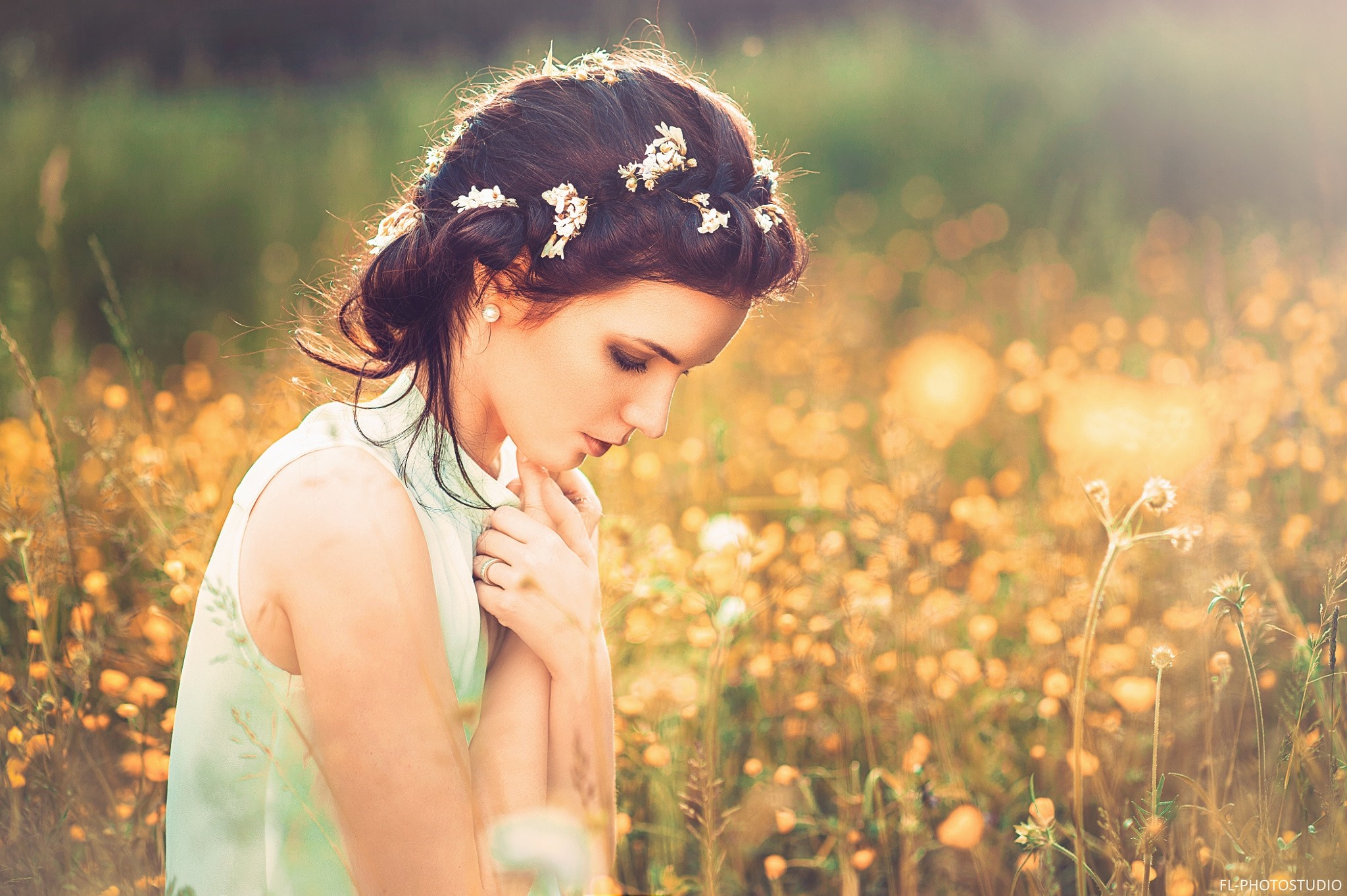 Woman with flowers in hair in a field HD Wallpaper