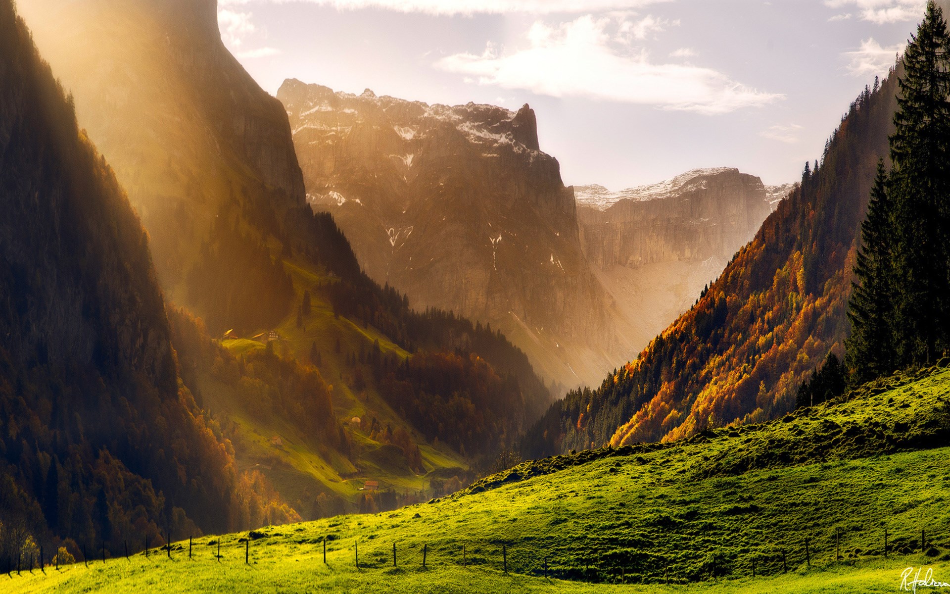 Sunlight streams through a mountain valley in autumn HD Wallpaper