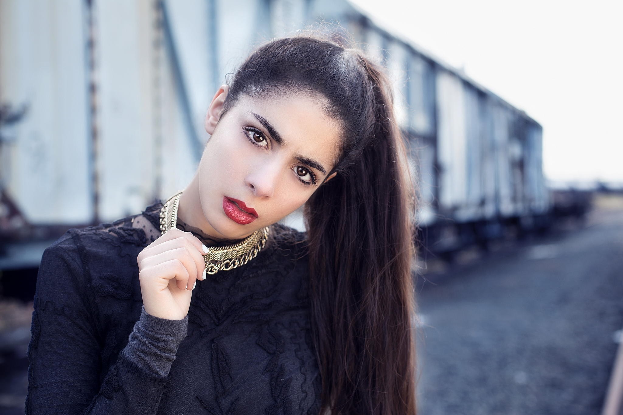 Woman with long dark hair and gold necklace HD Wallpaper