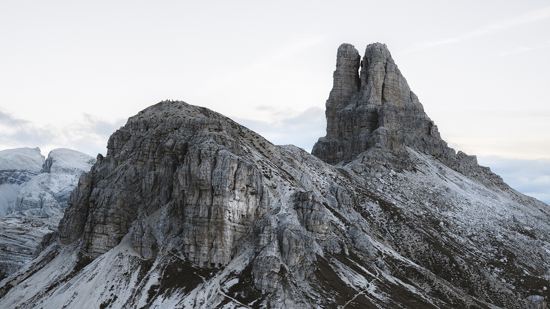 Rocky mountain peaks with snow and sky HD Wallpaper