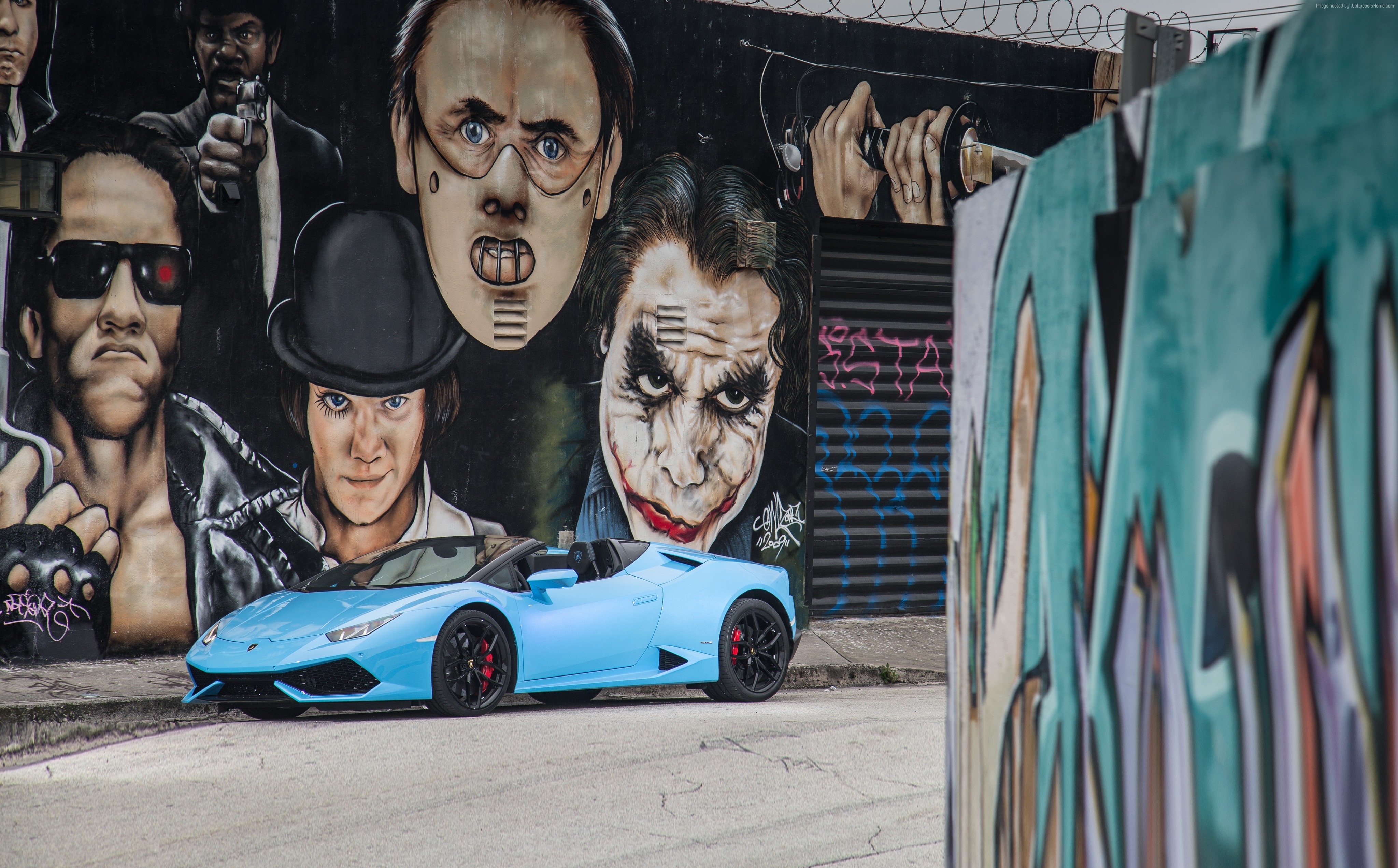 Blue Lamborghini Huracan Spyder in front of movie character graffiti HD Wallpaper